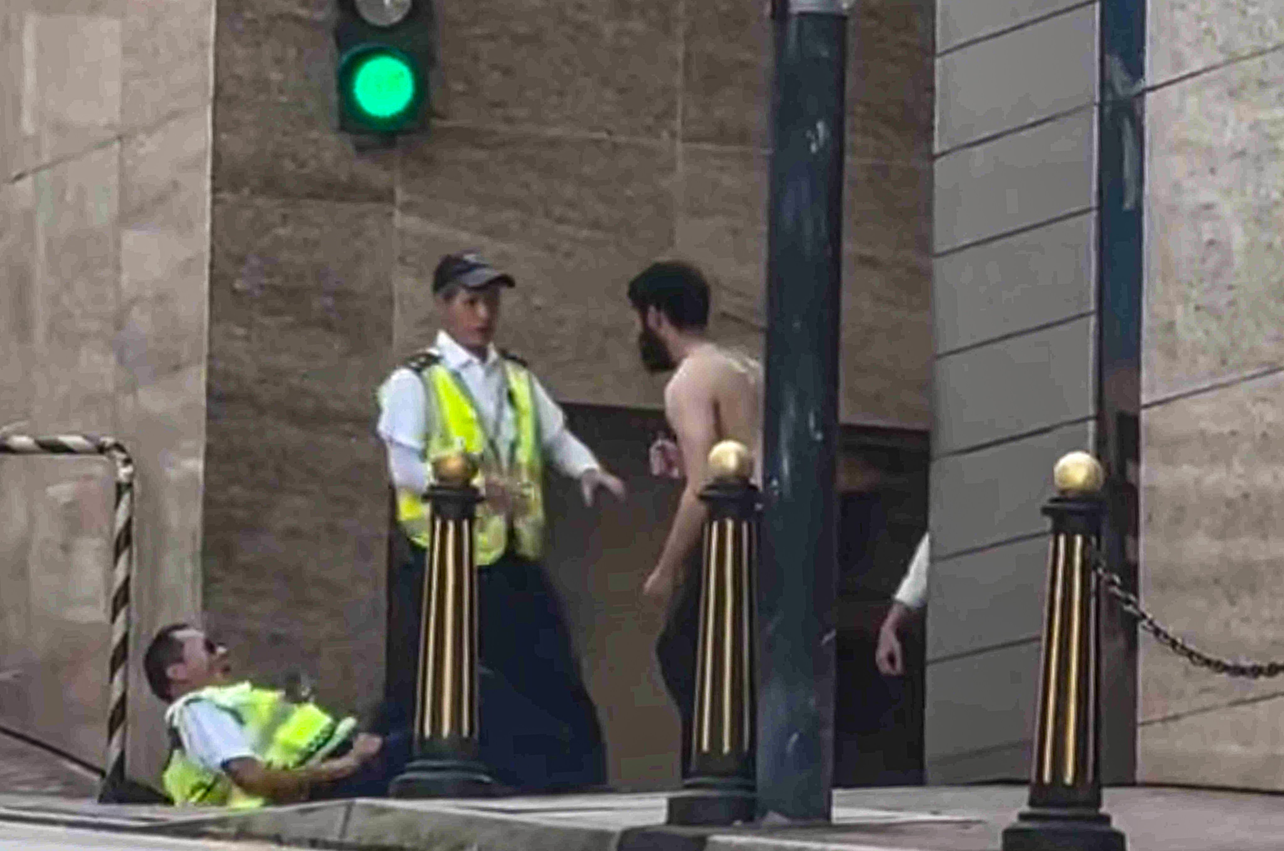 An online clip of the incident shows the attacker, armed with a knife, approaching security guards. Photo: Handout