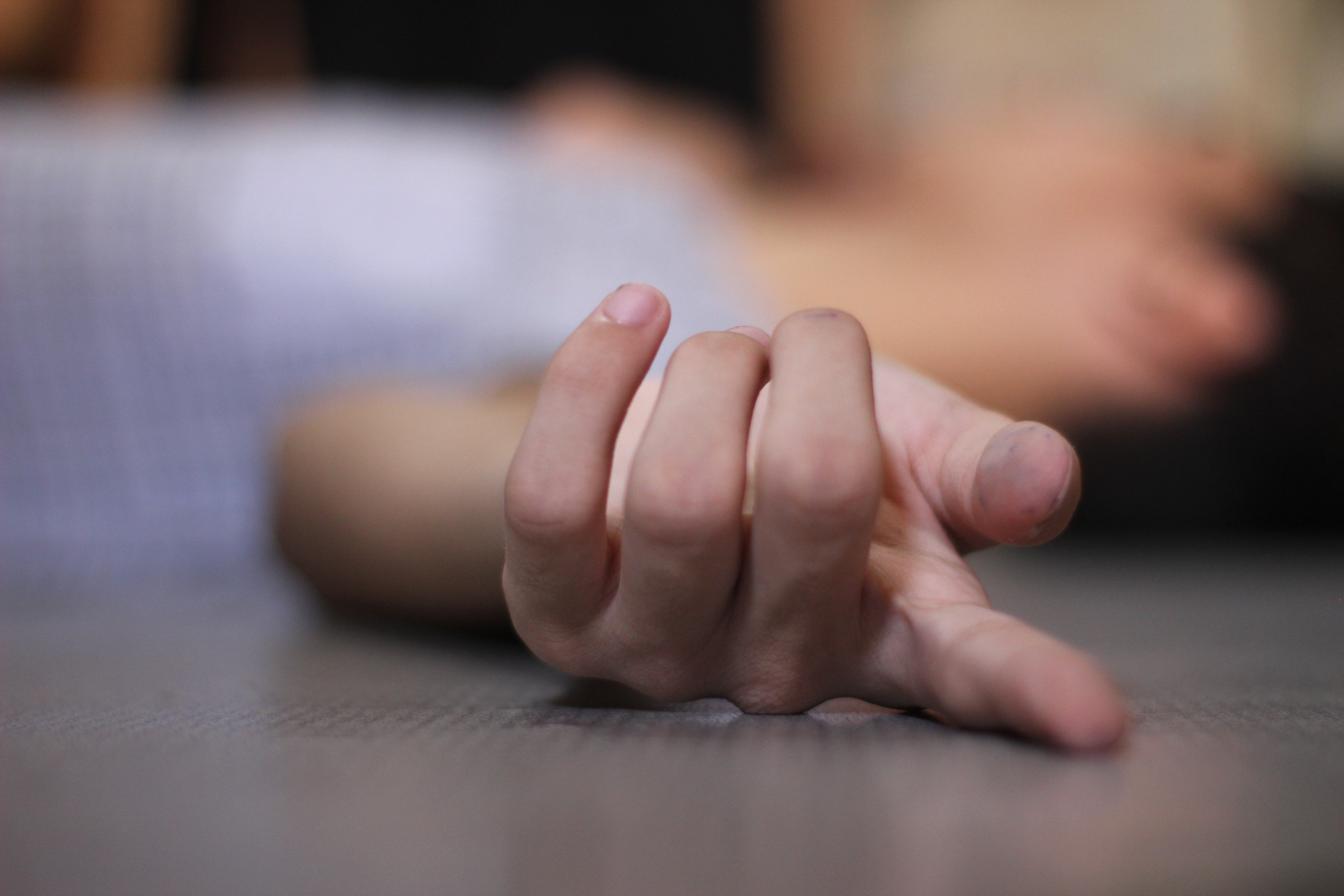 A victim lies on the floor. A 62-year-old woman is in critical condition after being set on fire on Sunday. Photo: Shutterstock