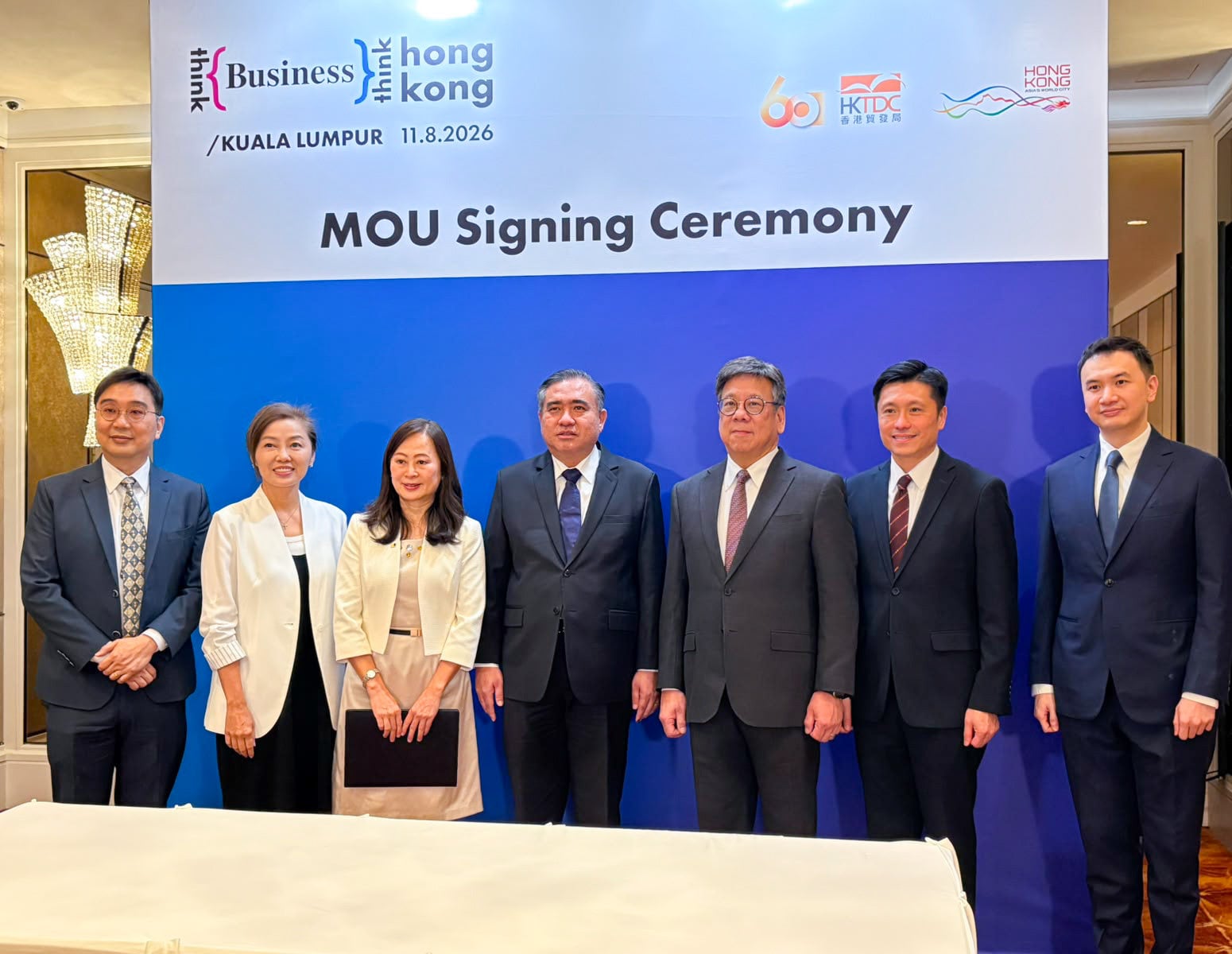 Secretary for Commerce and Economic Development Algernon Yau (third from right), Director of Information Services John Tse (fourth from right) and SCMP publisher Tammy Tam (third from left) at the MOU signing ceremony in Kuala Lumpur on Tuesday. Photo: Handout