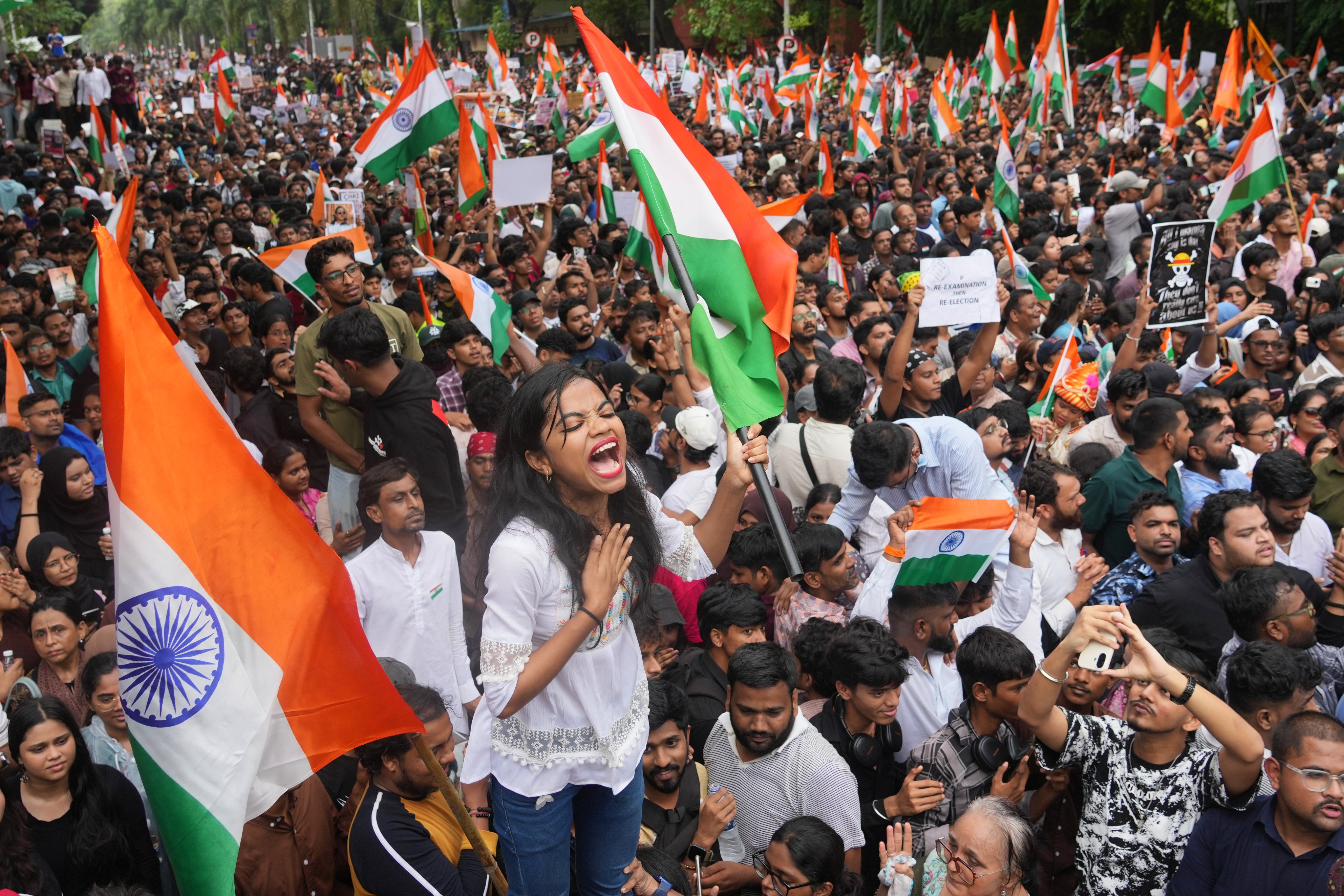 Protesters in Mumbai celebrate after Education Minister Dharmendra Pradhan resigned following nationwide protests as part of the Cockroach Janta Party’s protest movement on July 26. Photo: AP