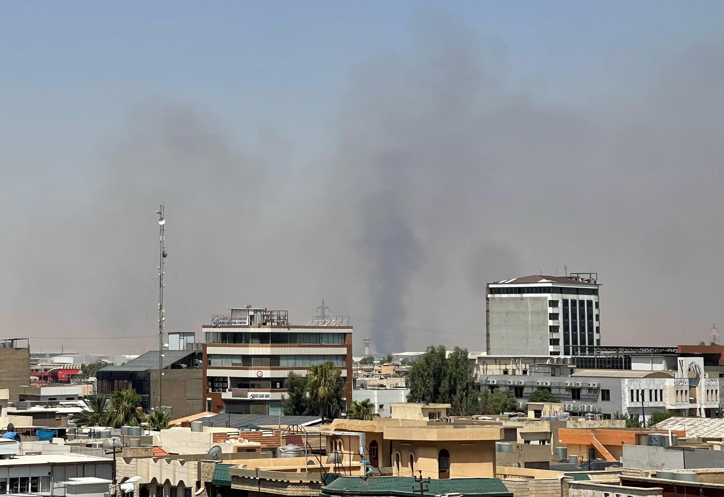 Black smoke rises following explosions near a military base hosting US forces in the northern Iraqi city of Irbil in July. Photo: AP