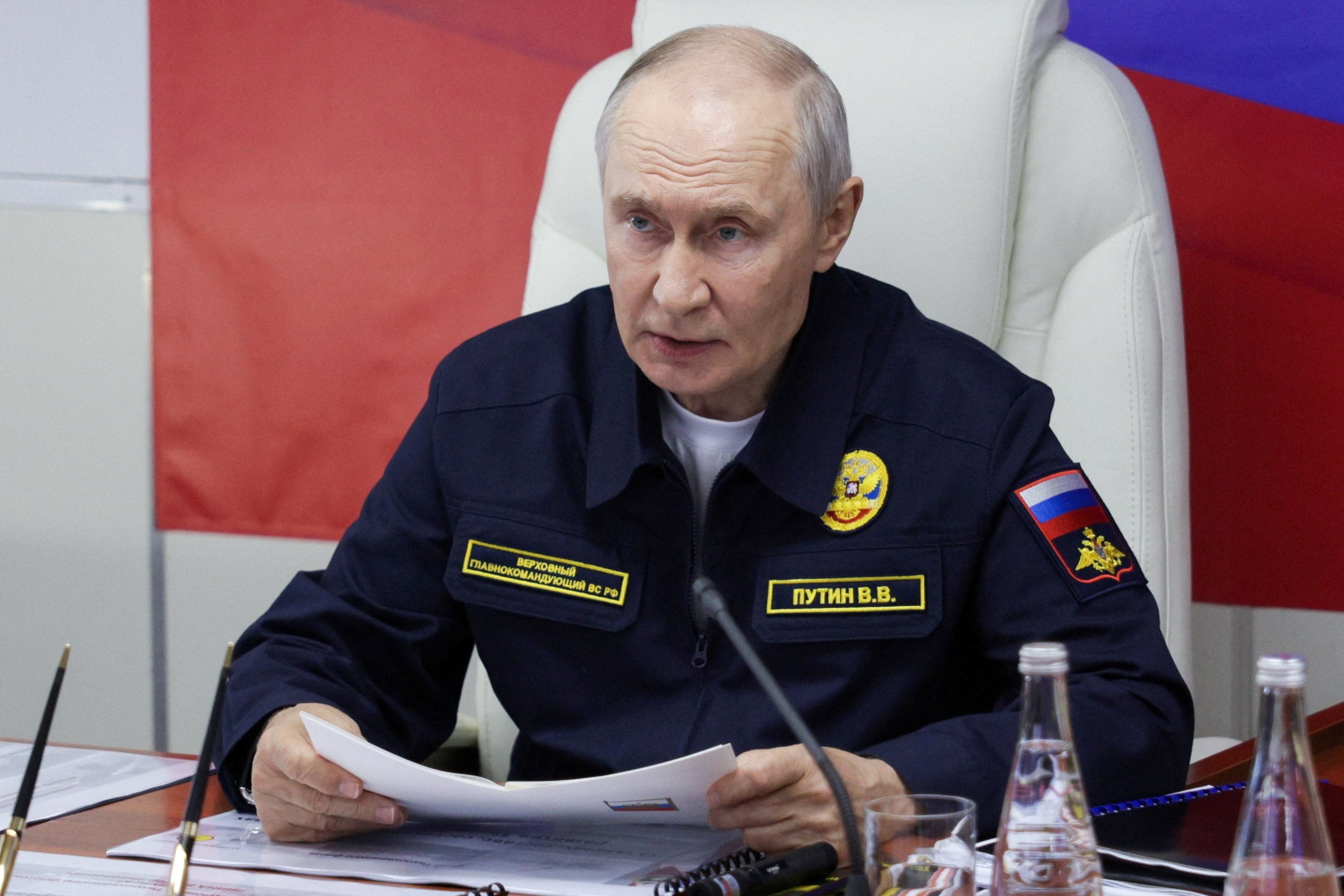 Russian President Vladimir Putin chairs a meeting on board a missile cruiser in Russia’s Sakhalin region on Wednesday. Photo: Sputnik/Reuters