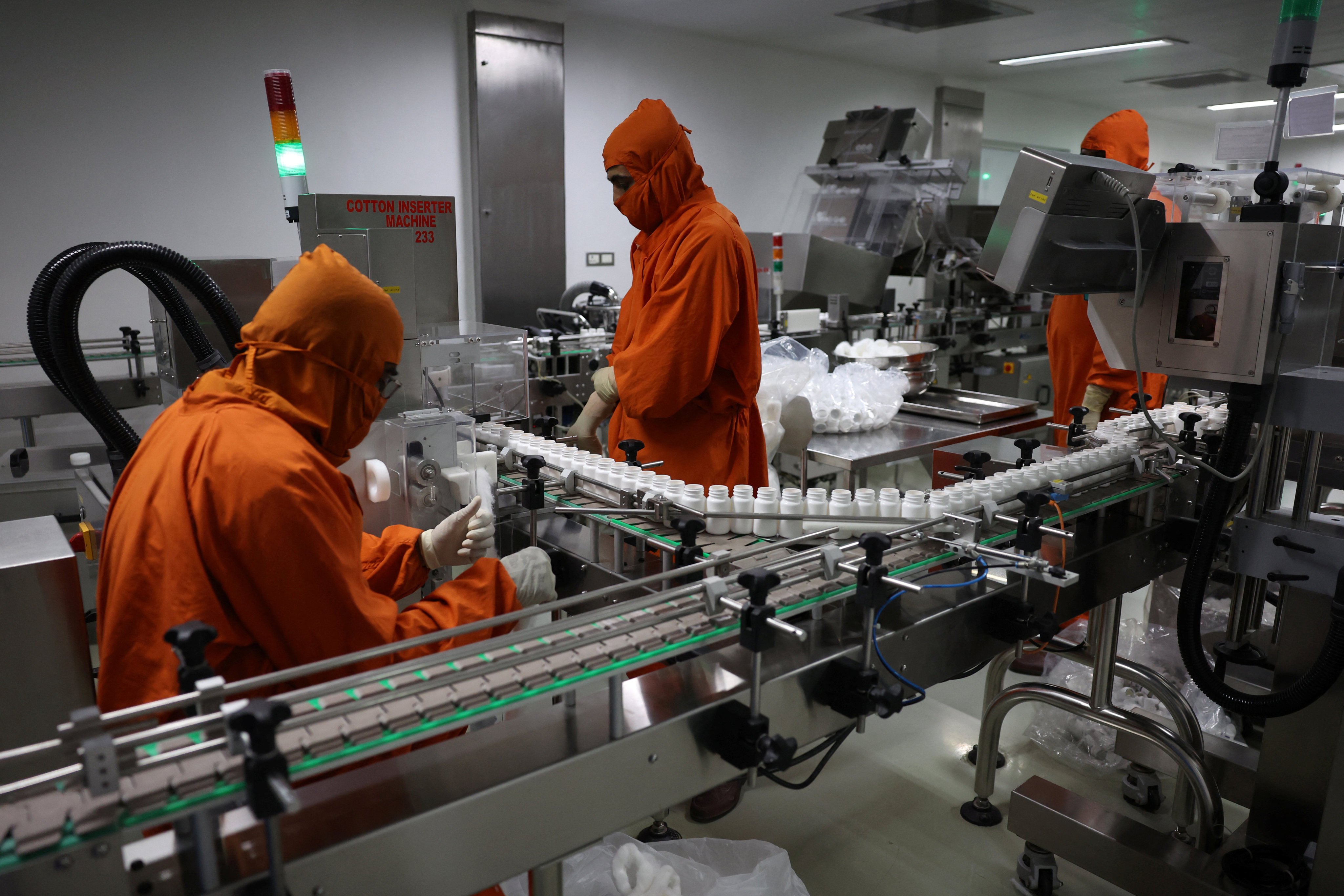 Employees work inside a pharmaceutical company manufacturing unit on the outskirts of Ahmedabad, India, in April 2025. Photo: Reuters
