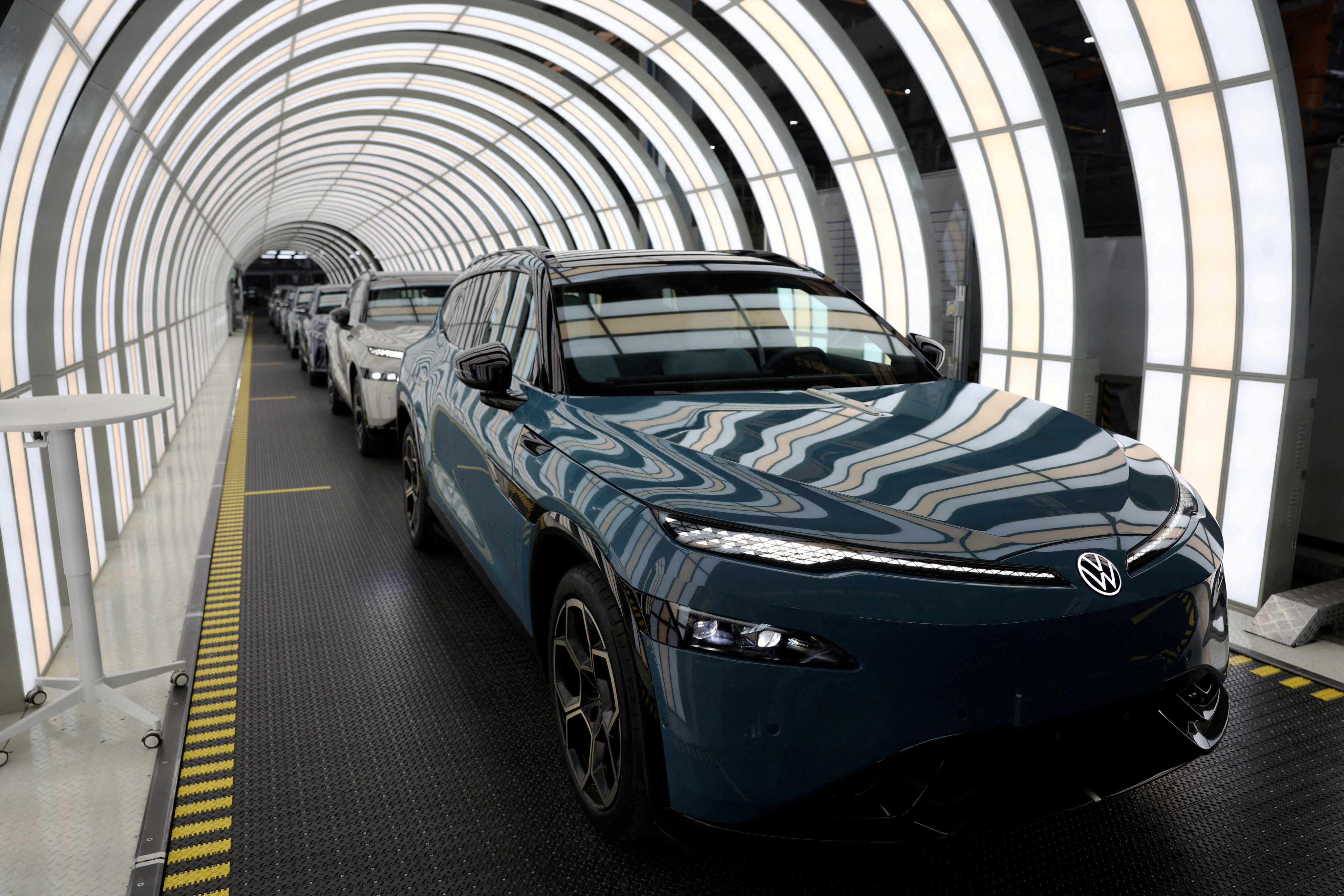 Electric vehicles made by Volkswagen are seen on a production line in China’s Anhui province earlier this year. Photo: Reuters