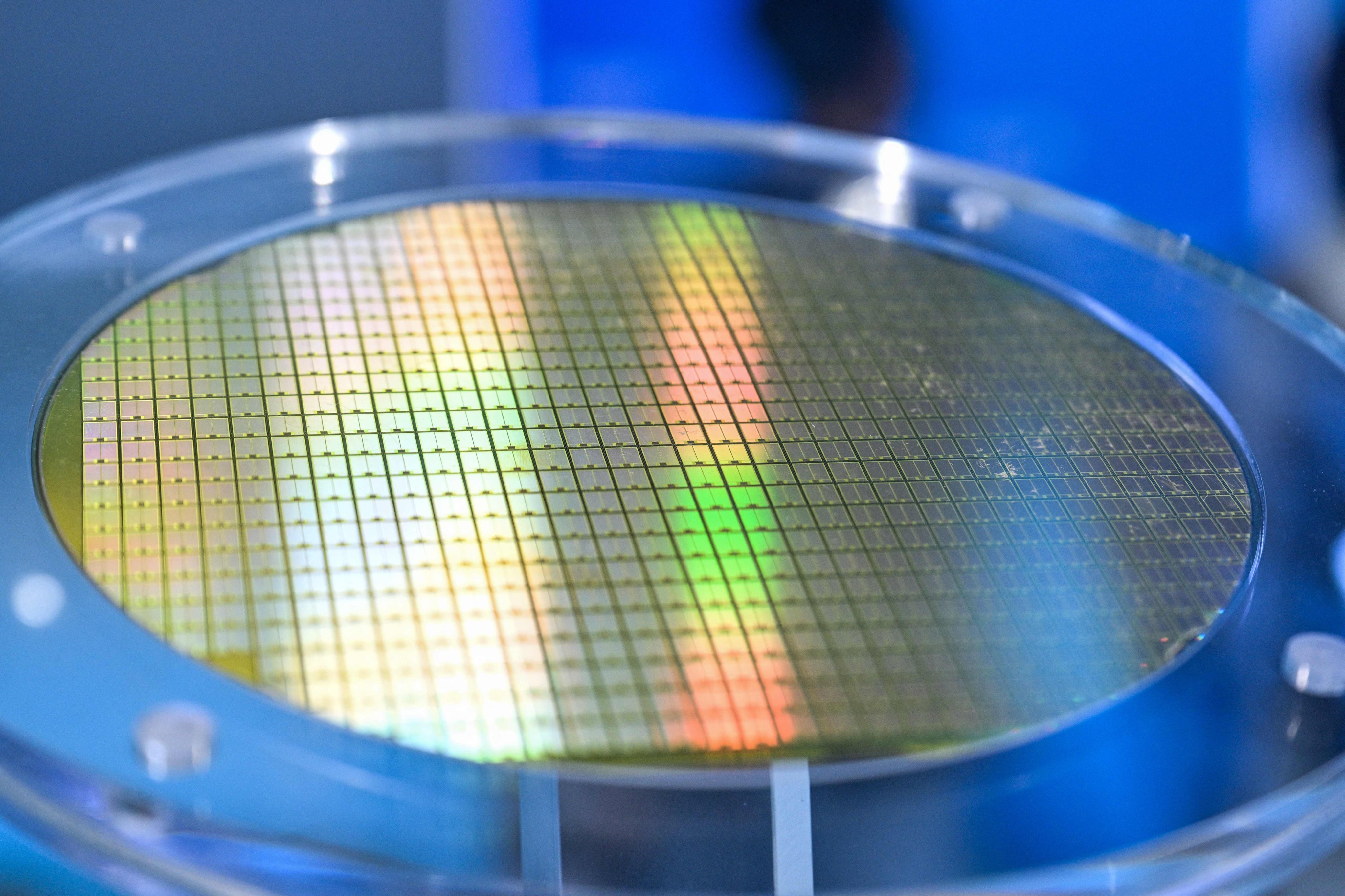 A wafer sample is seen during the World Artificial Intelligence Conference in Shanghai on July 18. China is looking to cultivate an alternative chipmaking ecosystem. Photo: AFP