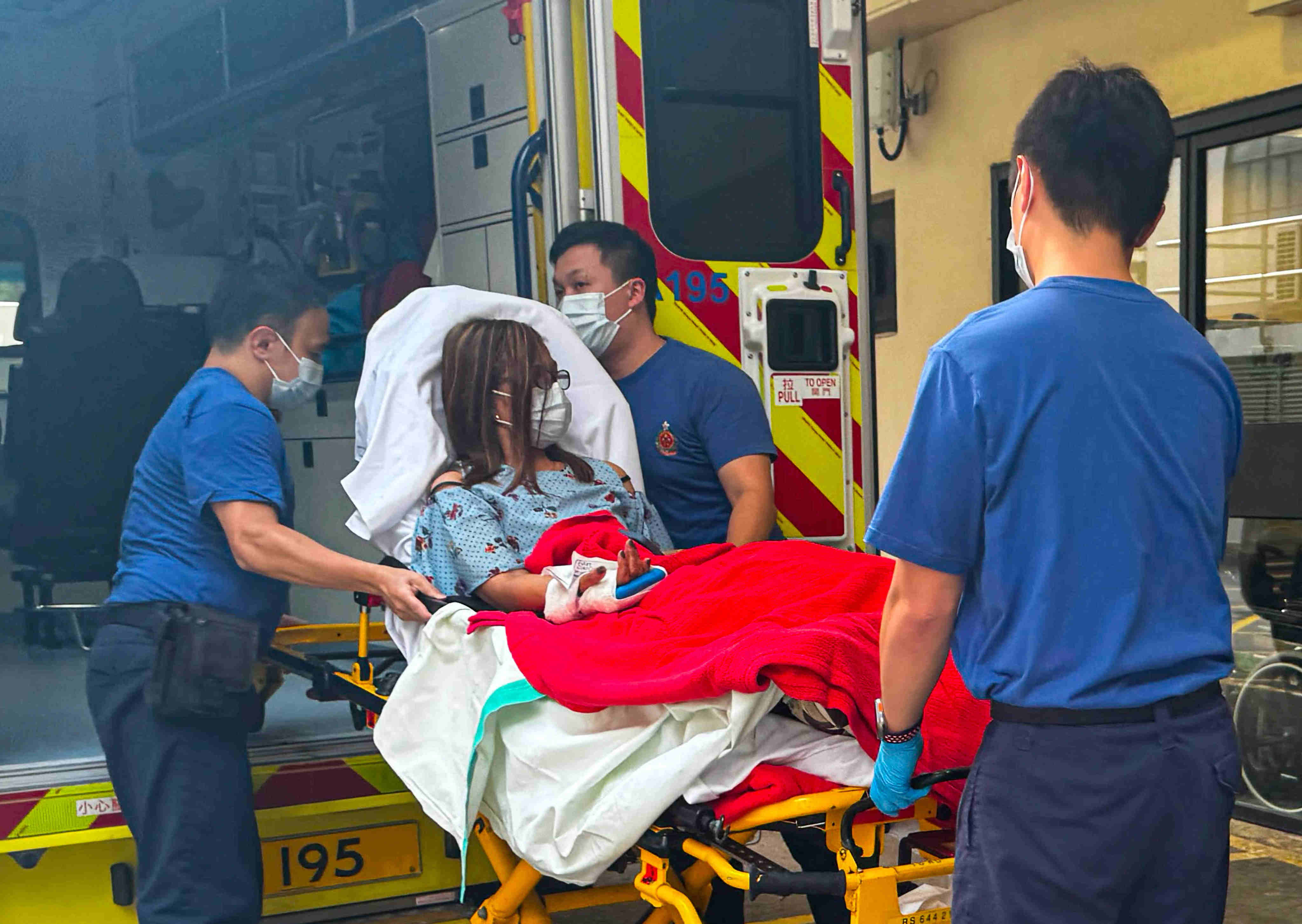 Emergency responders send an injured passenger for treatment. Photo: Handout
