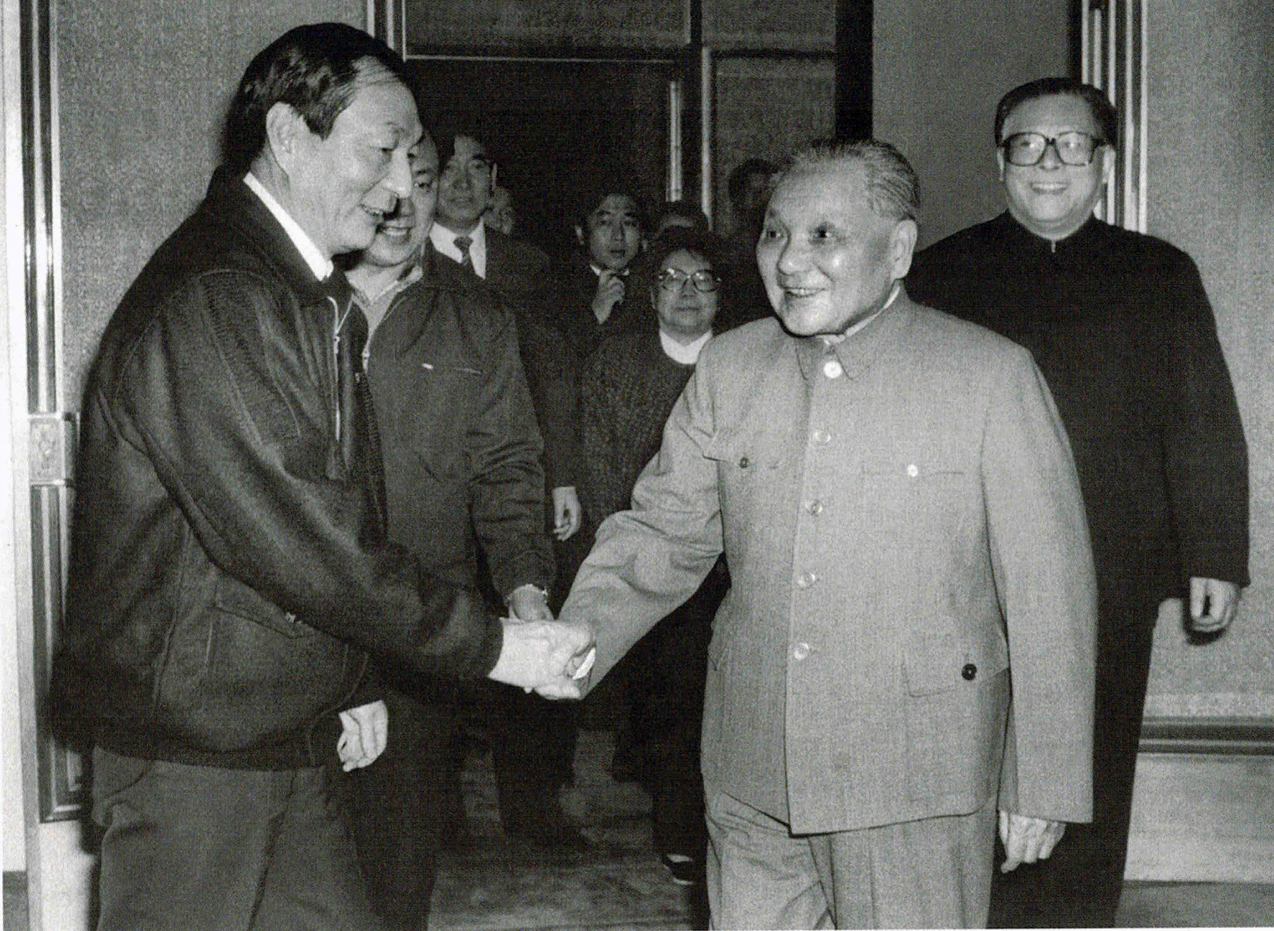 Zhu Rongji shakes hands with Deng Xiaoping as Jiang Zemin (right) looks on during a visit to Shanghai. Photo: Handout