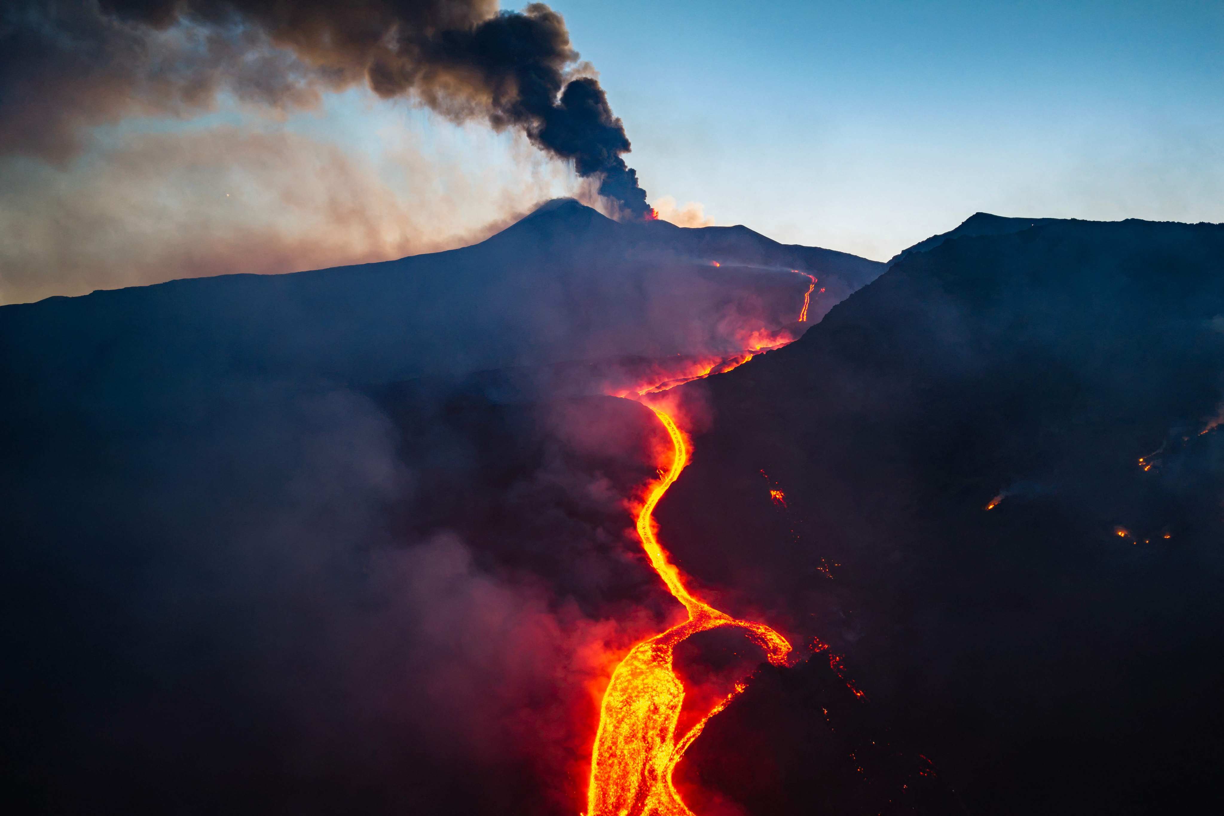 Smoke spews and lava flows from Sicily’s Mount Etna on Tuesday. Photo: Etna Walk via AFP
