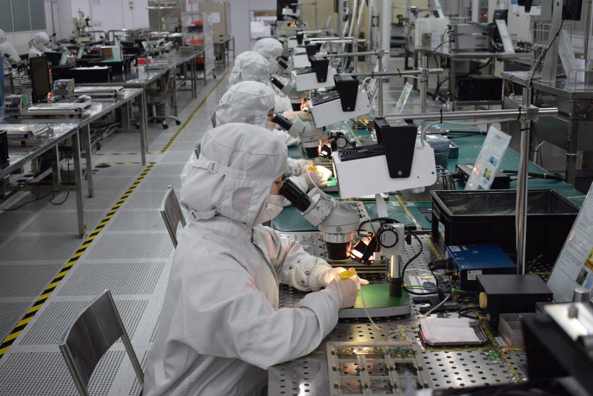 Workers at Cloud Light’s factory in Dongguan, Guangdong province. Cloud Light manufactures fibre optic transceivers, a device used in data centres to send data over fibre optic cables. Photo: Handout