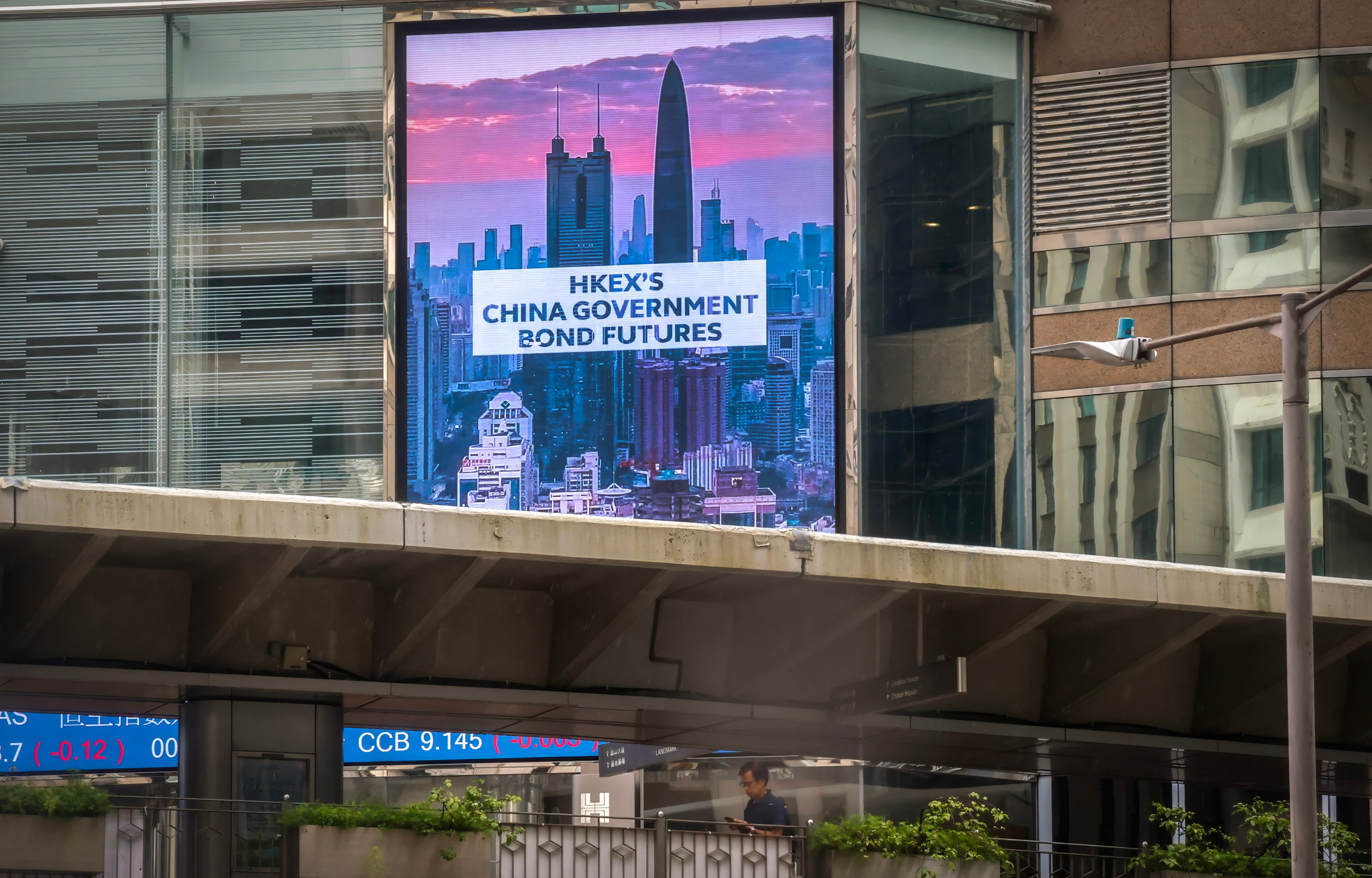An LED billboard at the Hong Kong Exchanges and Clearing building advertises the launch of offshore Chinese government bond futures in the city on August 3. Photo: Jonathan Wong