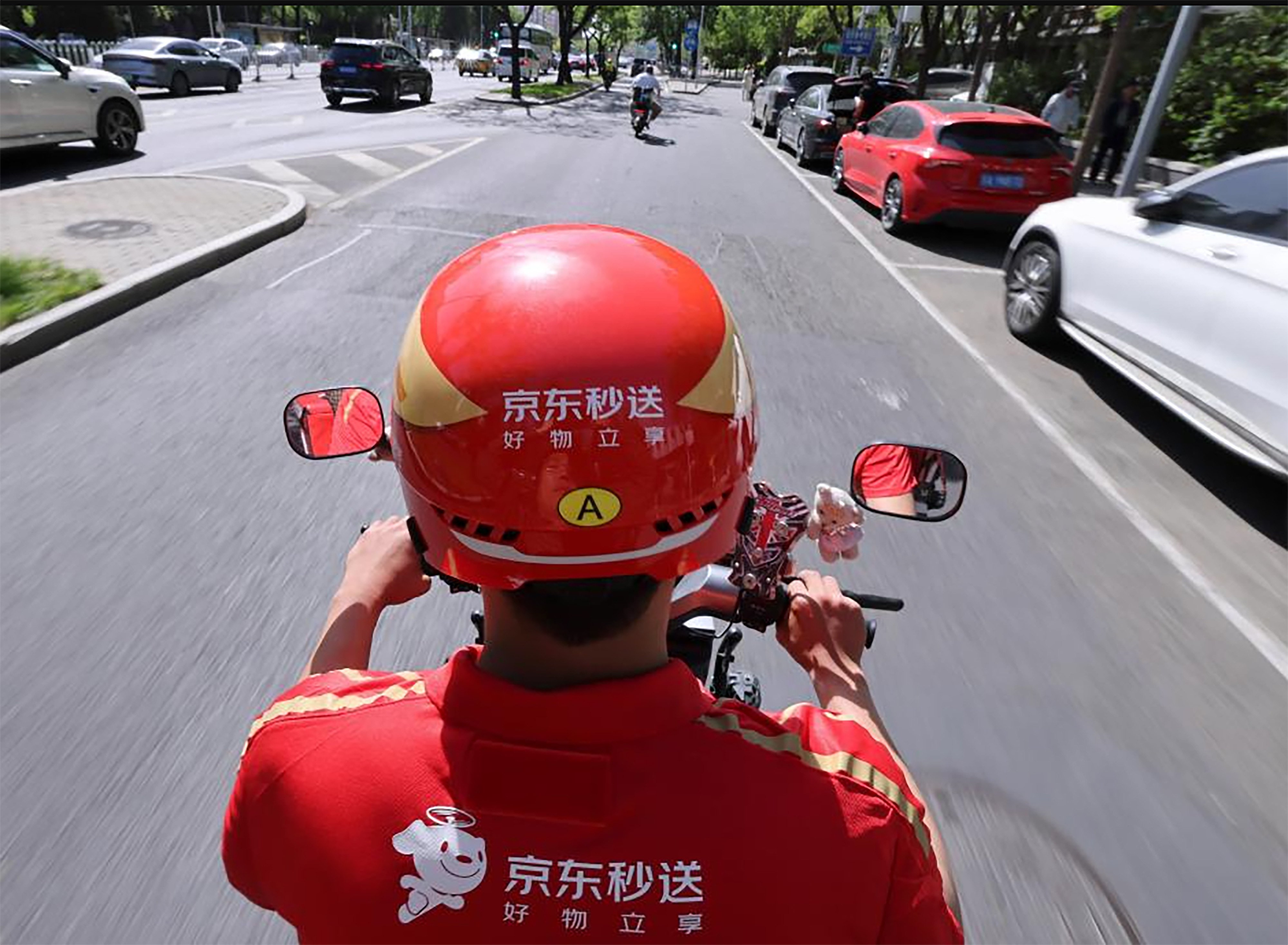 The results underscore the impact of JD.com’s expansion into food delivery, logistics and international operations over the past year. Photo: Xinhua