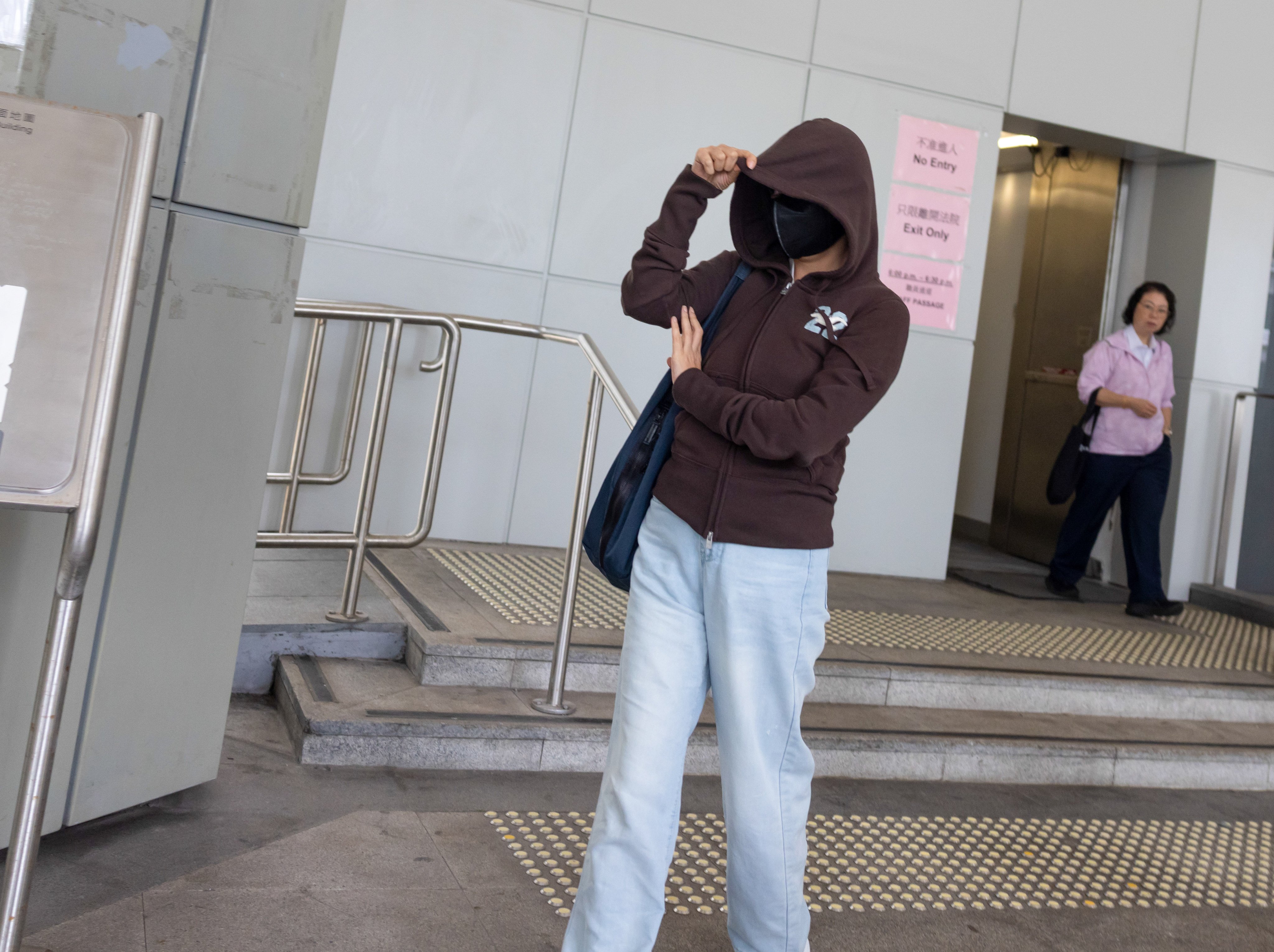 Ng Ka-man, wife of the finance director, leaves the High Court on June 12 following a hearing. Photo: Brian Wong