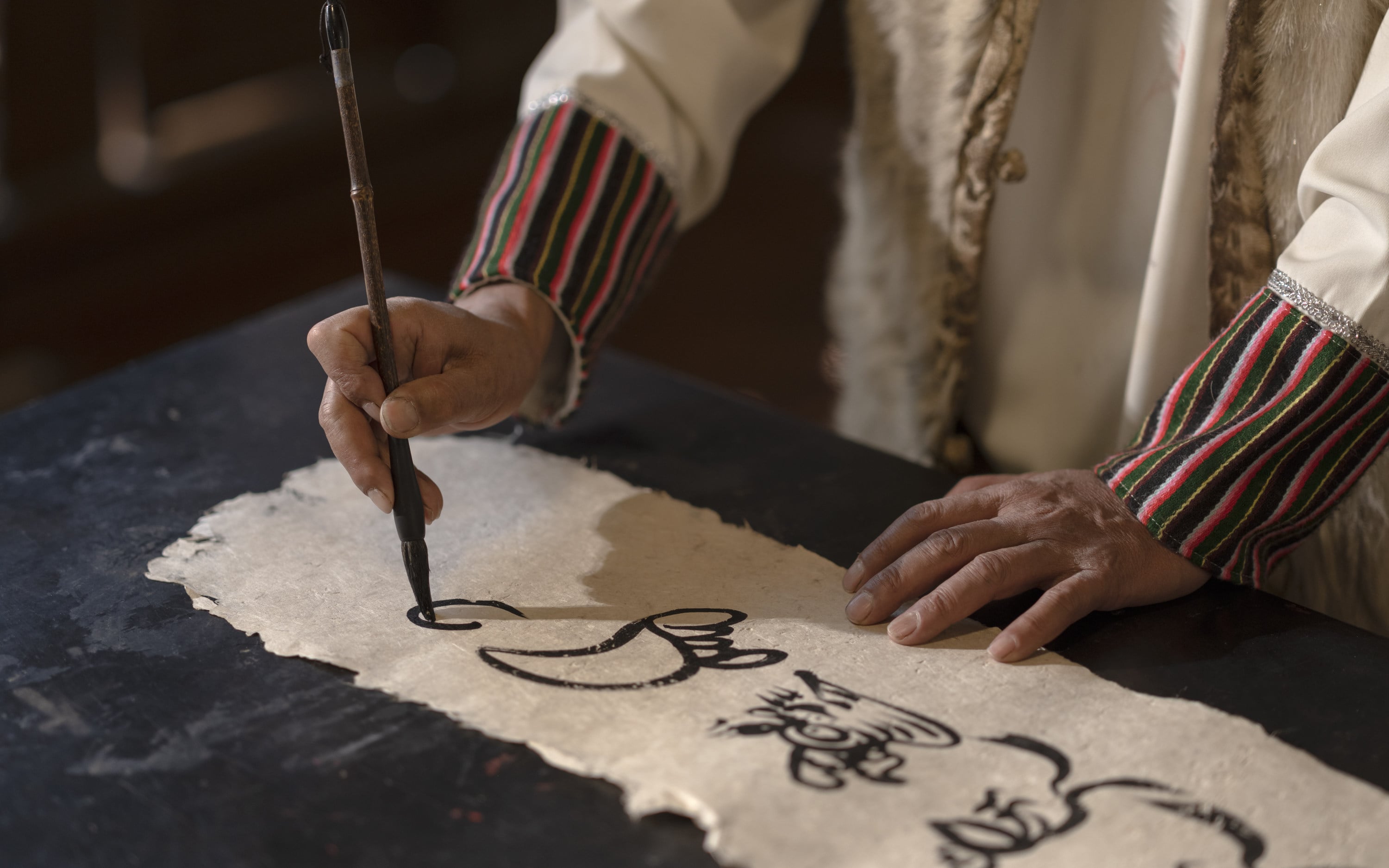 Dongba script, the world’s only hieroglyphic script still in use today, was created by Naxi shamans for sacred rituals. Photo: Amandayan