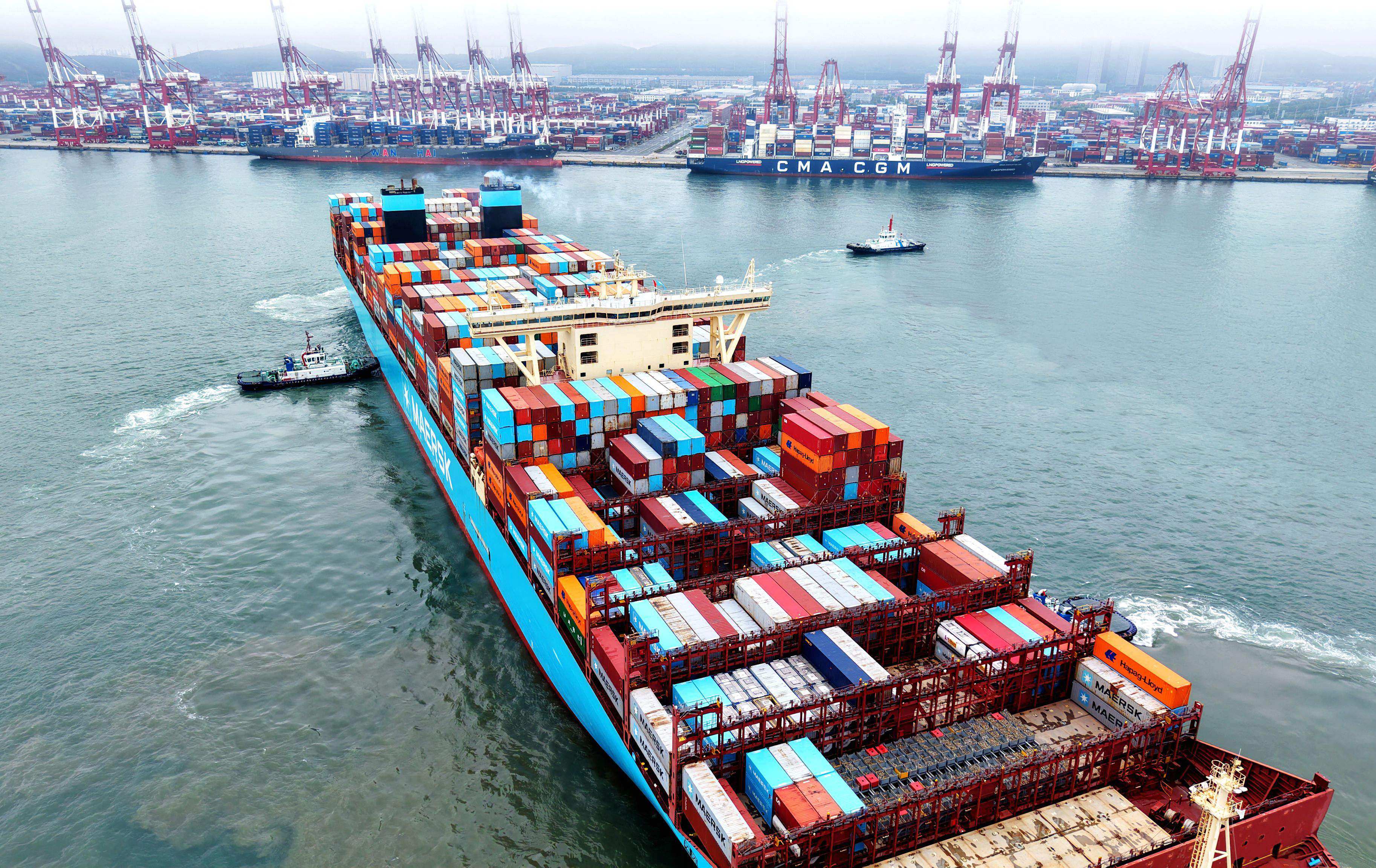 A container ship is moved into position at the port in Qingdao, in China’s eastern Shandong province, on May 26. Photo: AFP