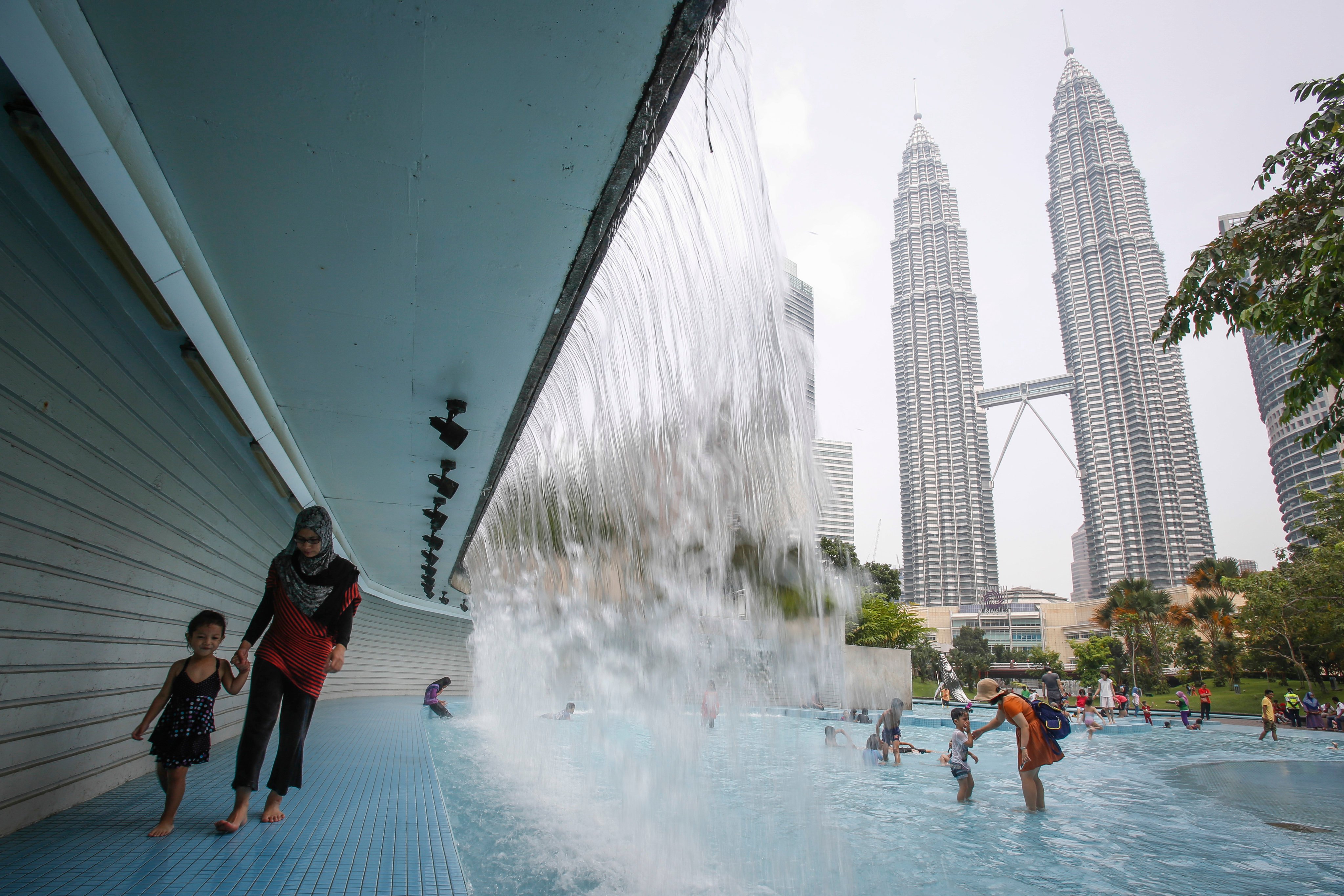 Malaysian women spend an average of six hours and seven minutes a day on unpaid domestic and care work. Photo: AP