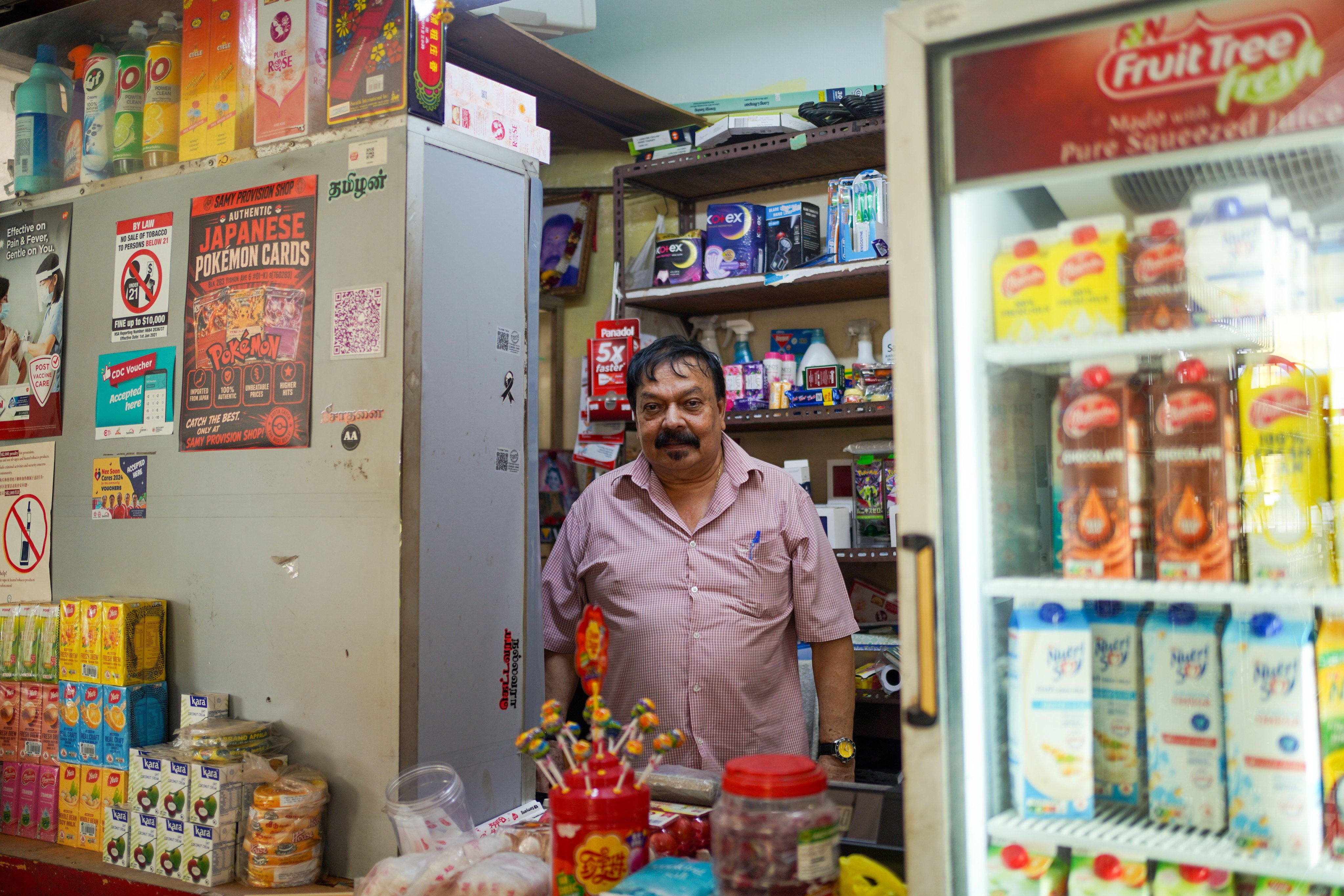 Ramasamy Vellasamy has been running a provision shop on the ground floor of a housing block in northern Singapore since 1986. Photo: Kolette Lim