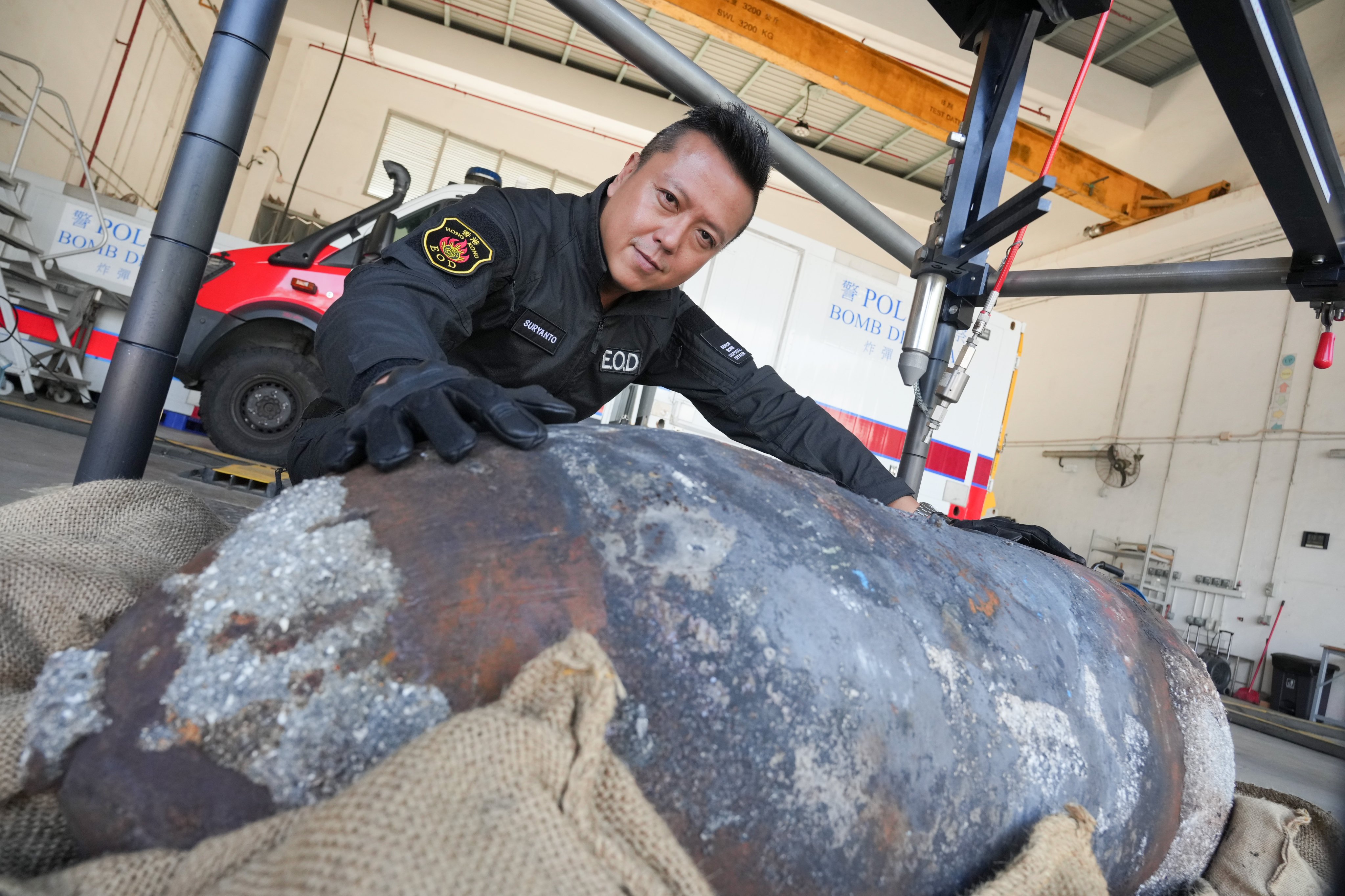 Raymond Suryanto poses with the empty shell casing of the Quarry Bay bomb. Photo: May Tse
