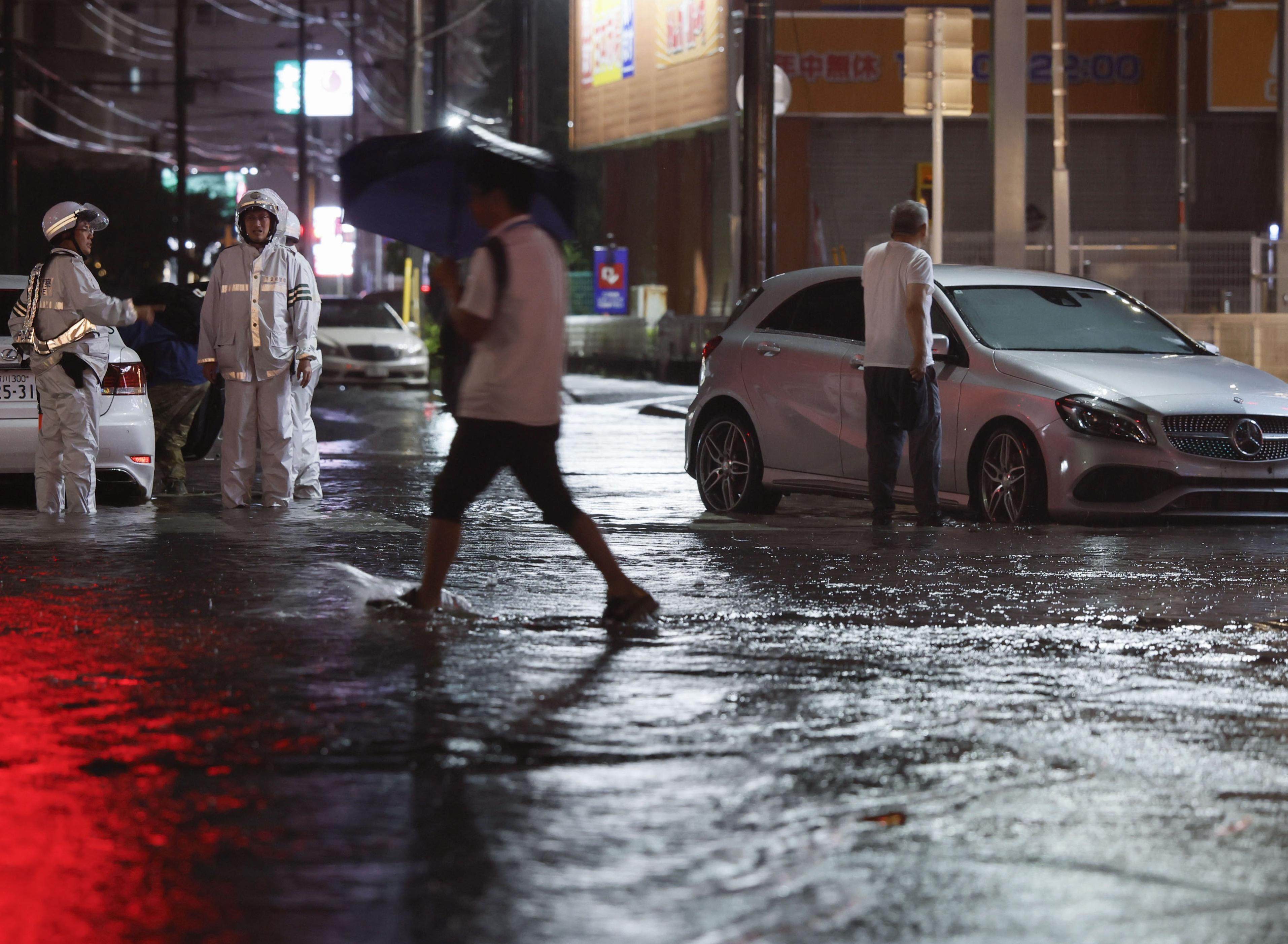 A flooded road in Ichikawa, Chiba prefecture, on Thursday night. Photo: Kyodo