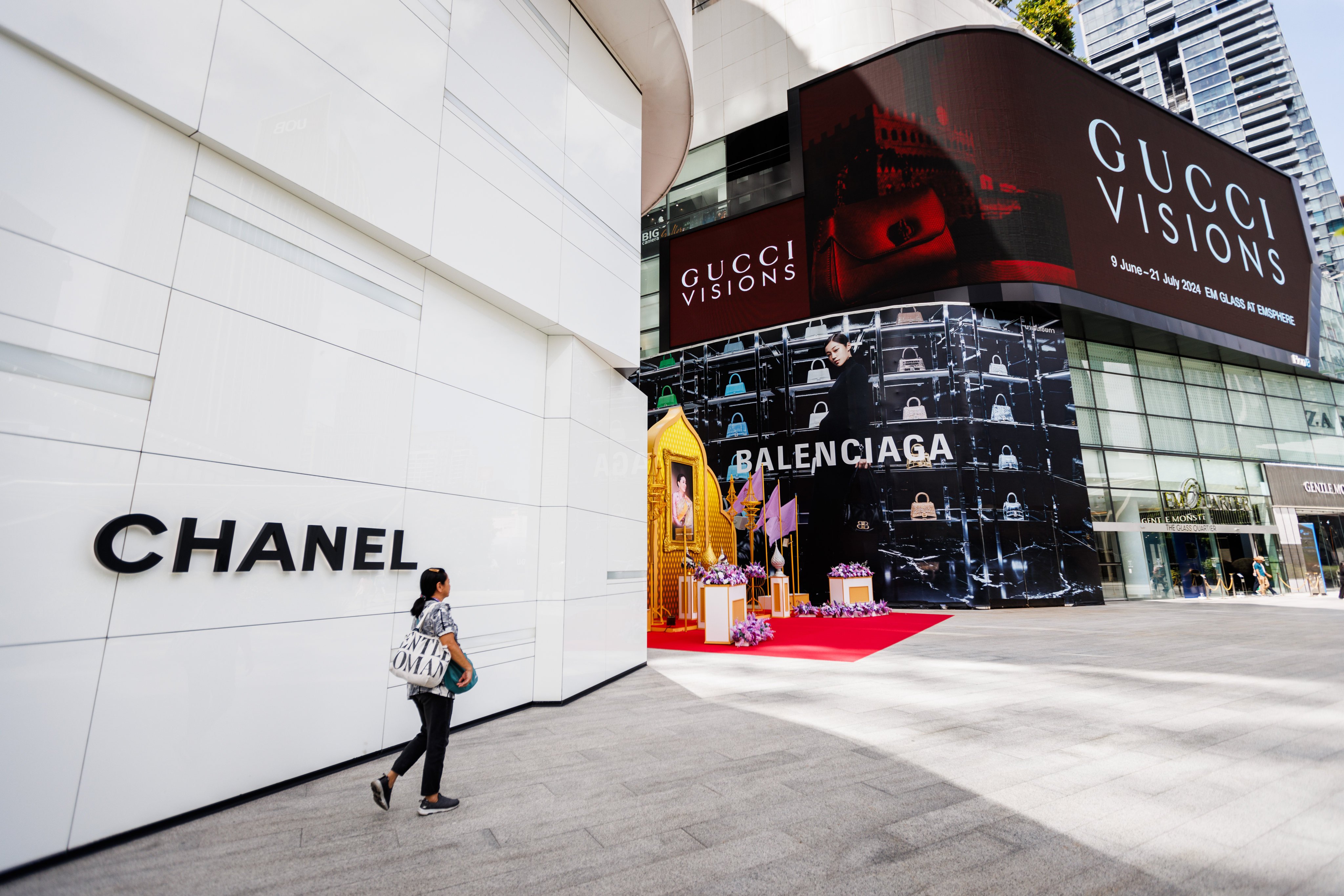 A woman walks past the entrance to the Chanel store at EmQuartier shopping mall in Bangkok, Thailand, in June 2024. Photo: Getty Images