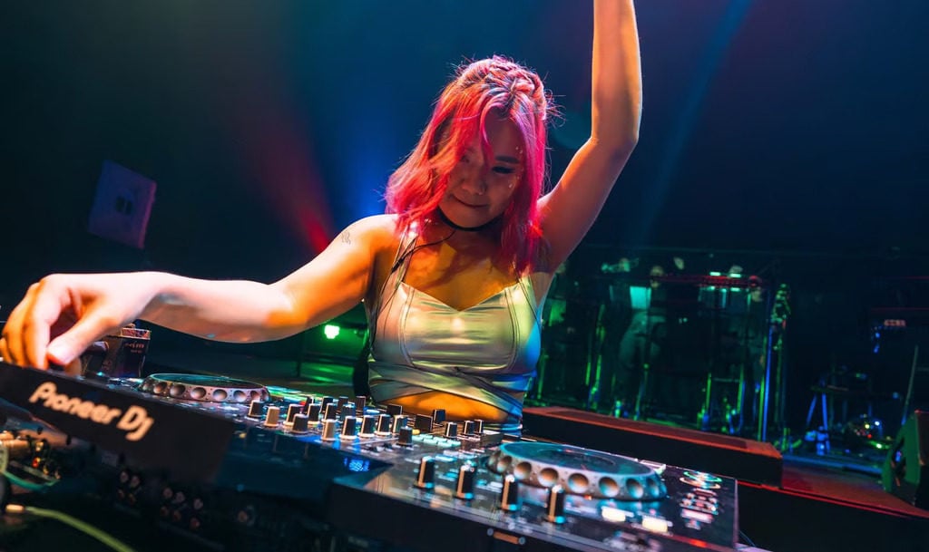 Likie Low, whose stage name is Likki, at the DJ table. Photo: Likki