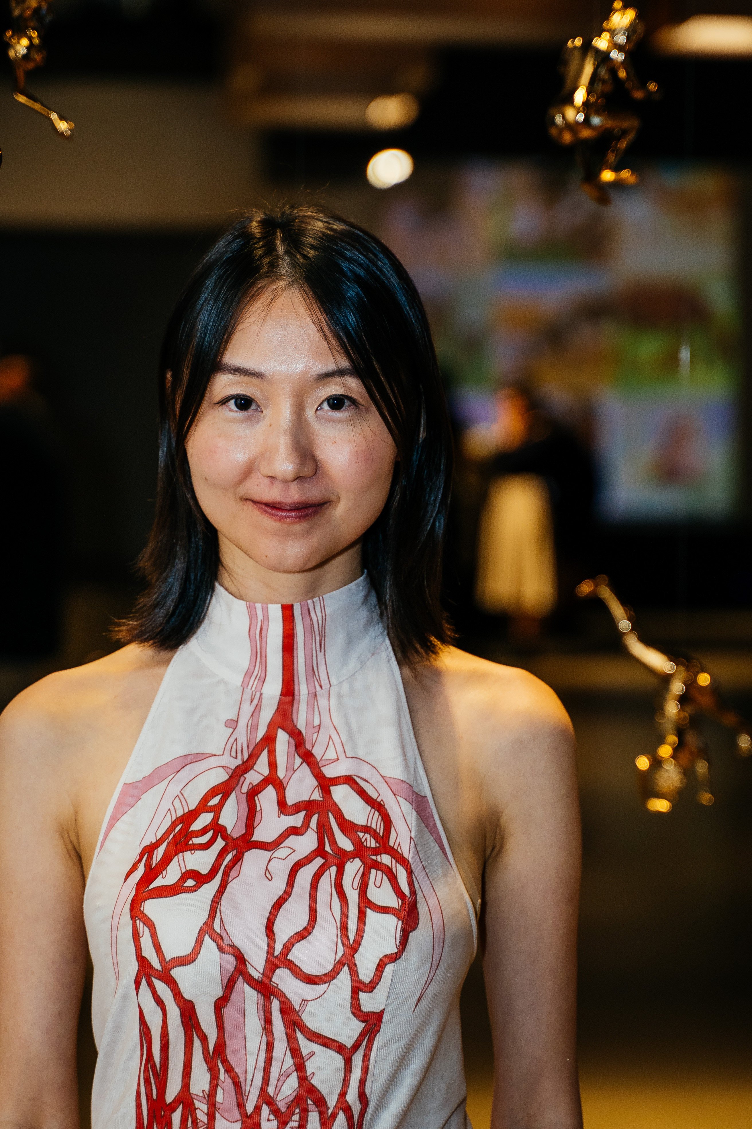 Artist Jiabao Li at her solo exhibition “Womb Wetware” at San Francisco’s Tiat Gallery. Photo: Daniel Clayton