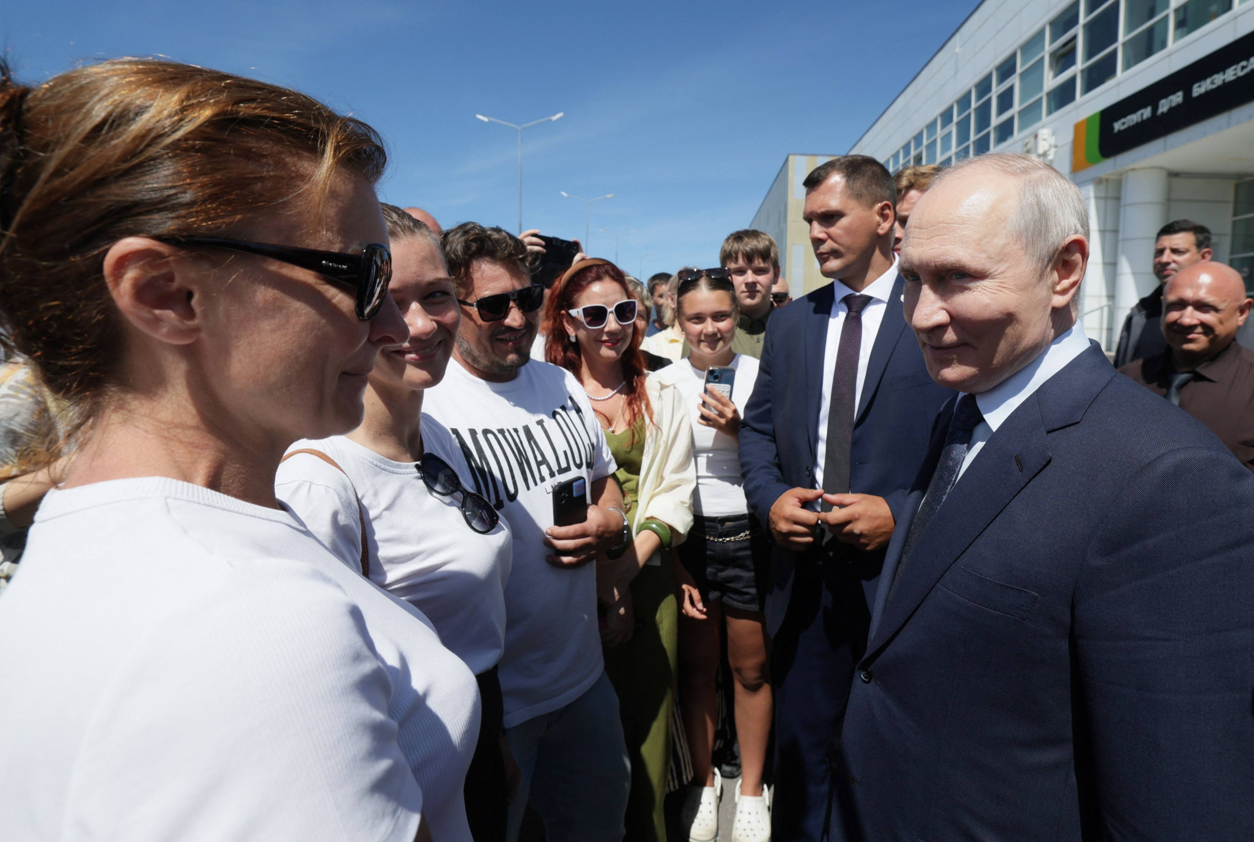 Russia’s President Vladimir Putin interacts on August 13 with local residents on Iturup island, one of four islands in the contested chain known as the Kuril Islands. Photo: AFP
