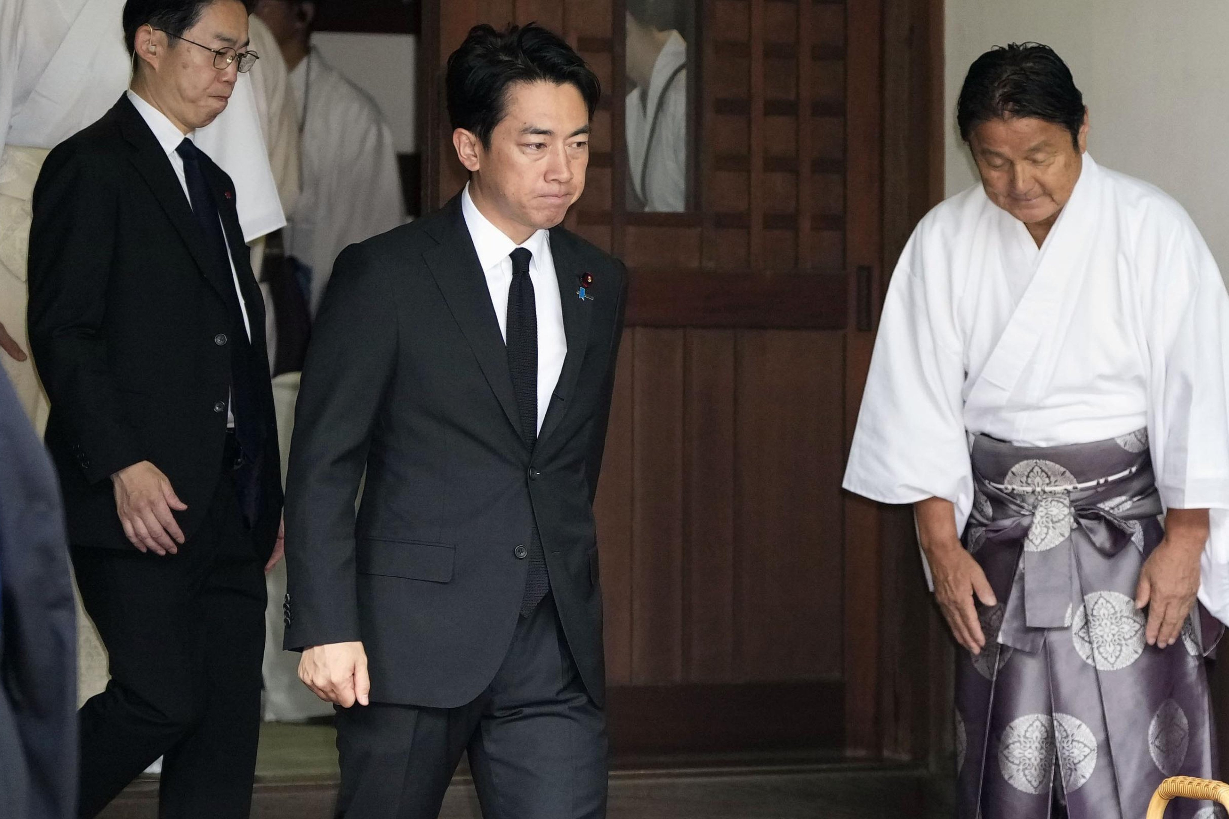Japan’s Defence Minister Shinjiro Koizumi (centre) visits Yasukuni Shrine in Tokyo on Saturday. Photo: Kyodo/AP