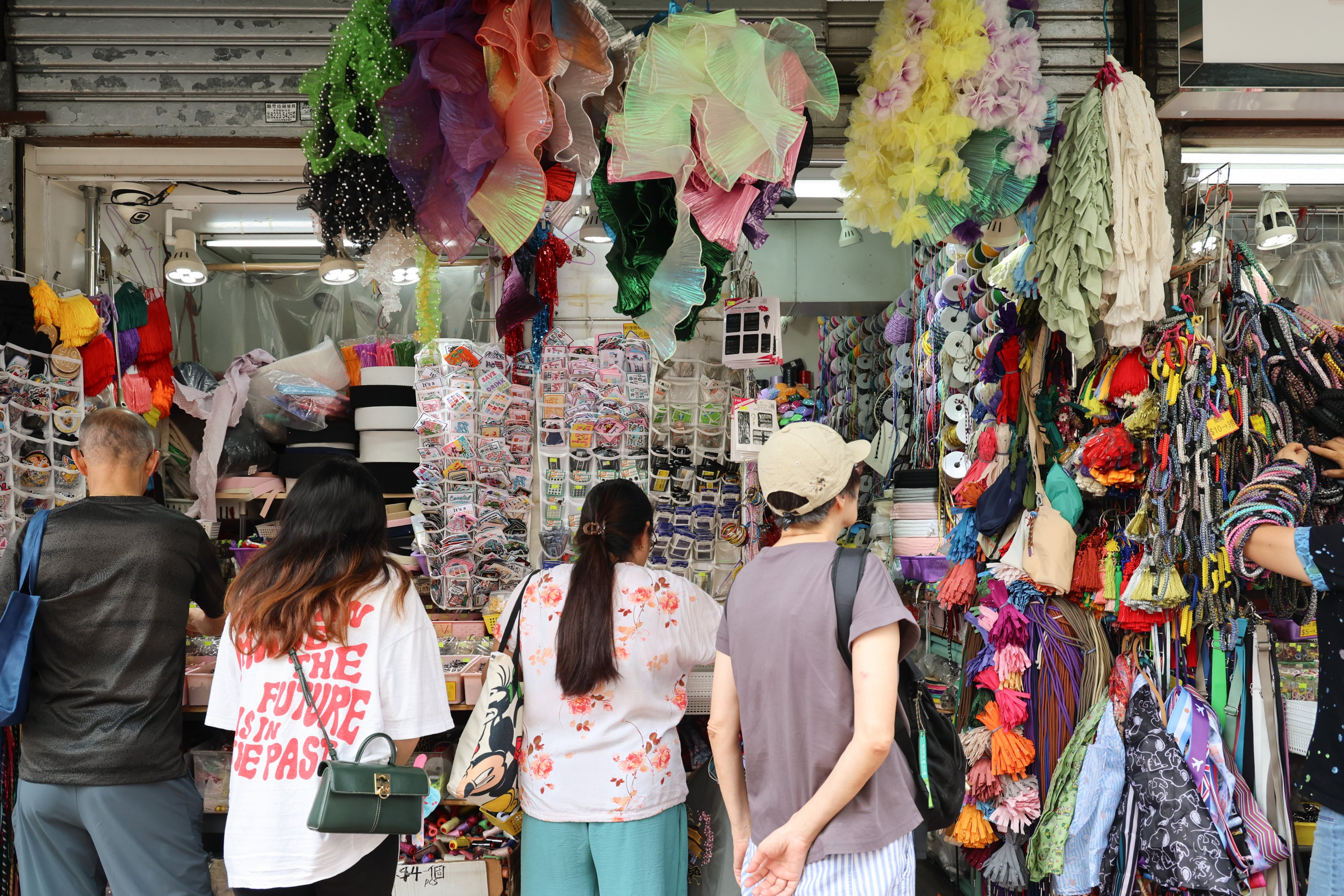 Clothing and accessories shops in Sham Shui Po are steadily dwindling, making way for the cafes and art galleries increasingly favoured by young people. Photo: Dickson Lee