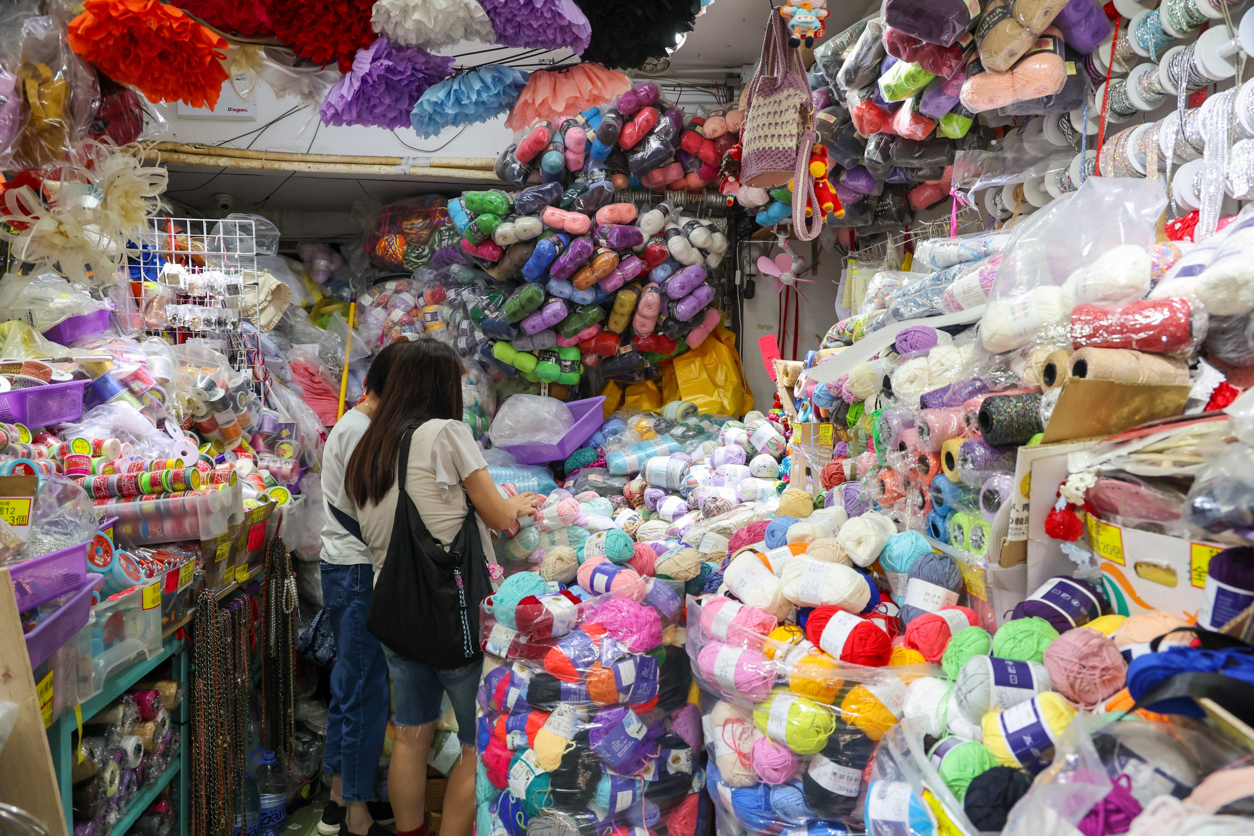 Clothing and accessories shops in Sham Shui Po are steadily dwindling, making way for the cafes and art galleries increasingly favoured by young people. Photo: Dickson Lee