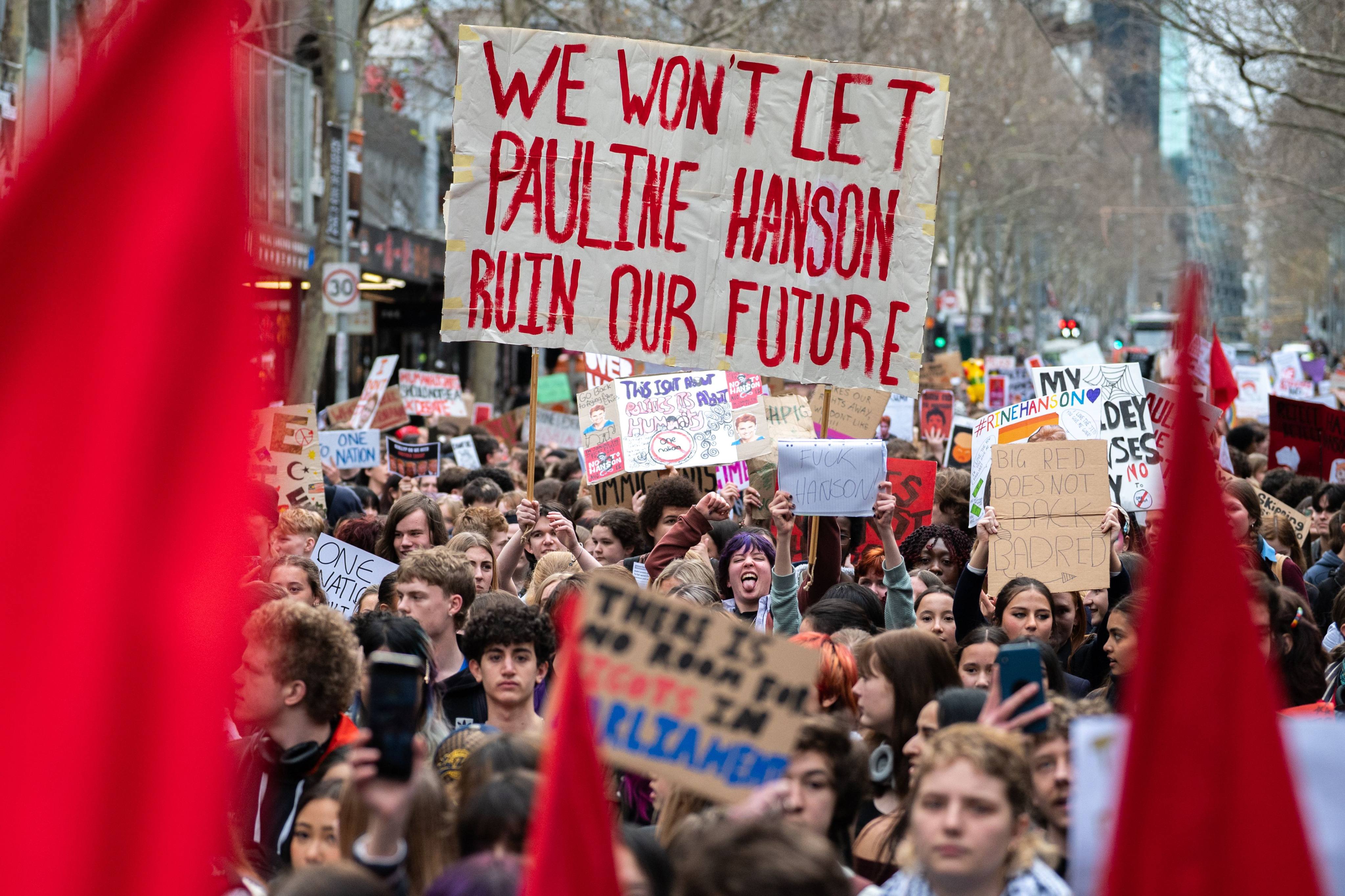 High school and university students opposed to the policies of Pauline Hanson and her far-right One Nation Party march through Melbourne on Thursday. Photo: dpa