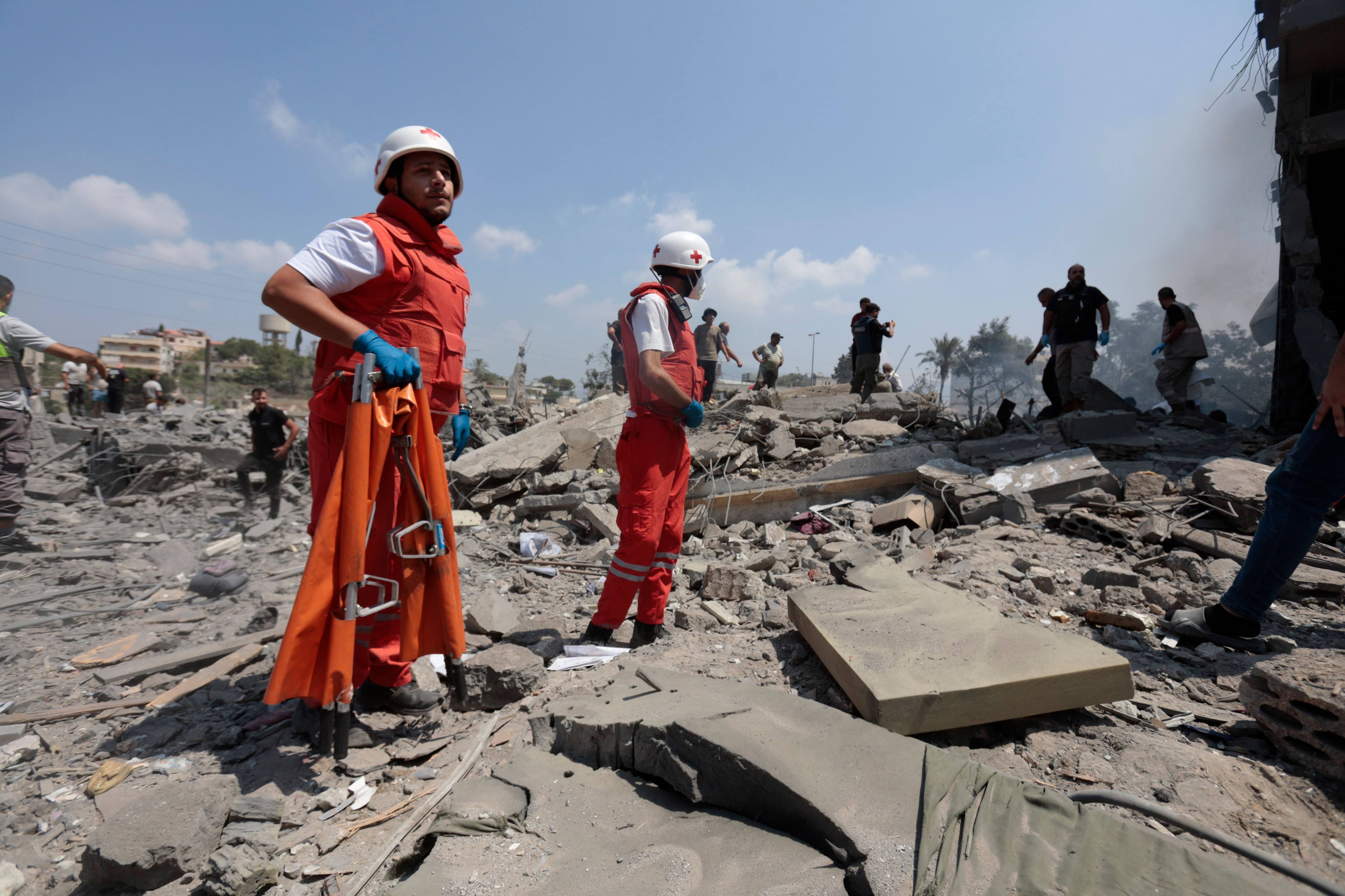 First responders search the rubble following an Israeli air strike on a house in a tourist area of Ansar, southern Lebanon, before dawn on Saturday. Photo: , dpa