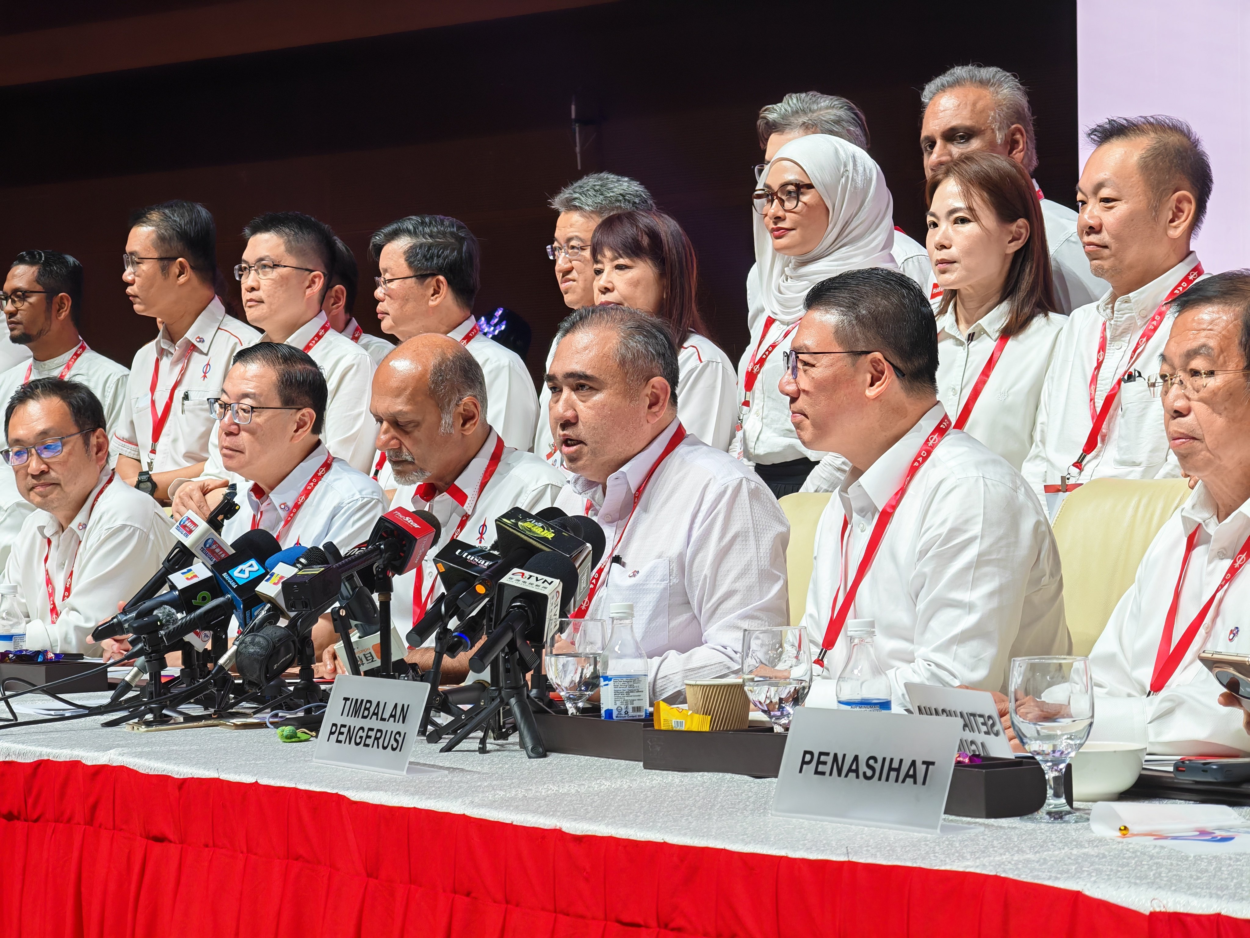 DAP Secretary General Anthony Loke (centre) answers questions from the media after the vote on Sunday. Photo: Joseph Sipalan