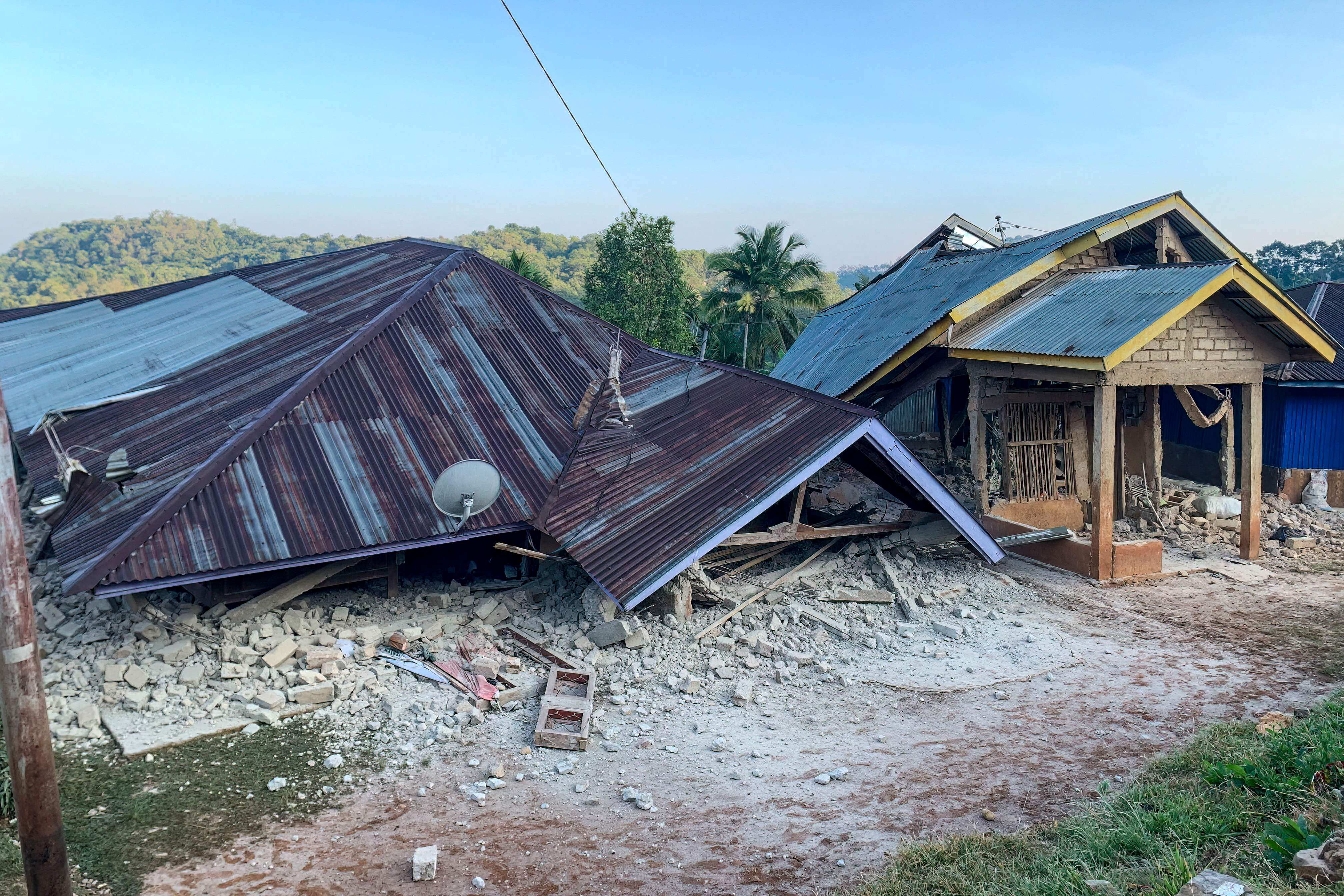 Damaged houses are seen following an earthquake in Ruteng, Manggarai, Indonesia’s East Nusa Tenggara, on Saturday. Photo: AFP