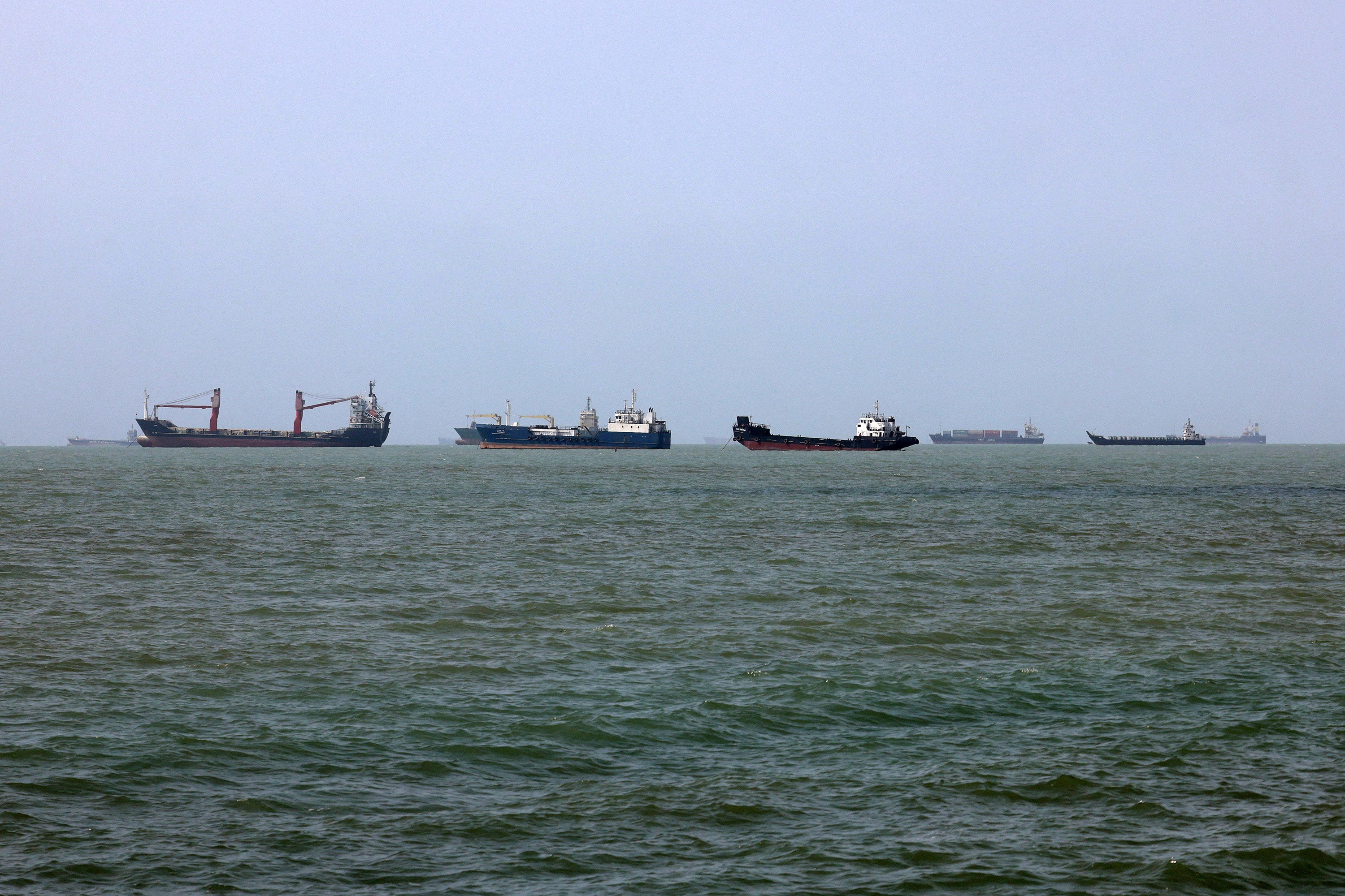Vessels transit the Strait of Hormuz off Bandar Abbas in southern Iran on August 10. Photo: TNS