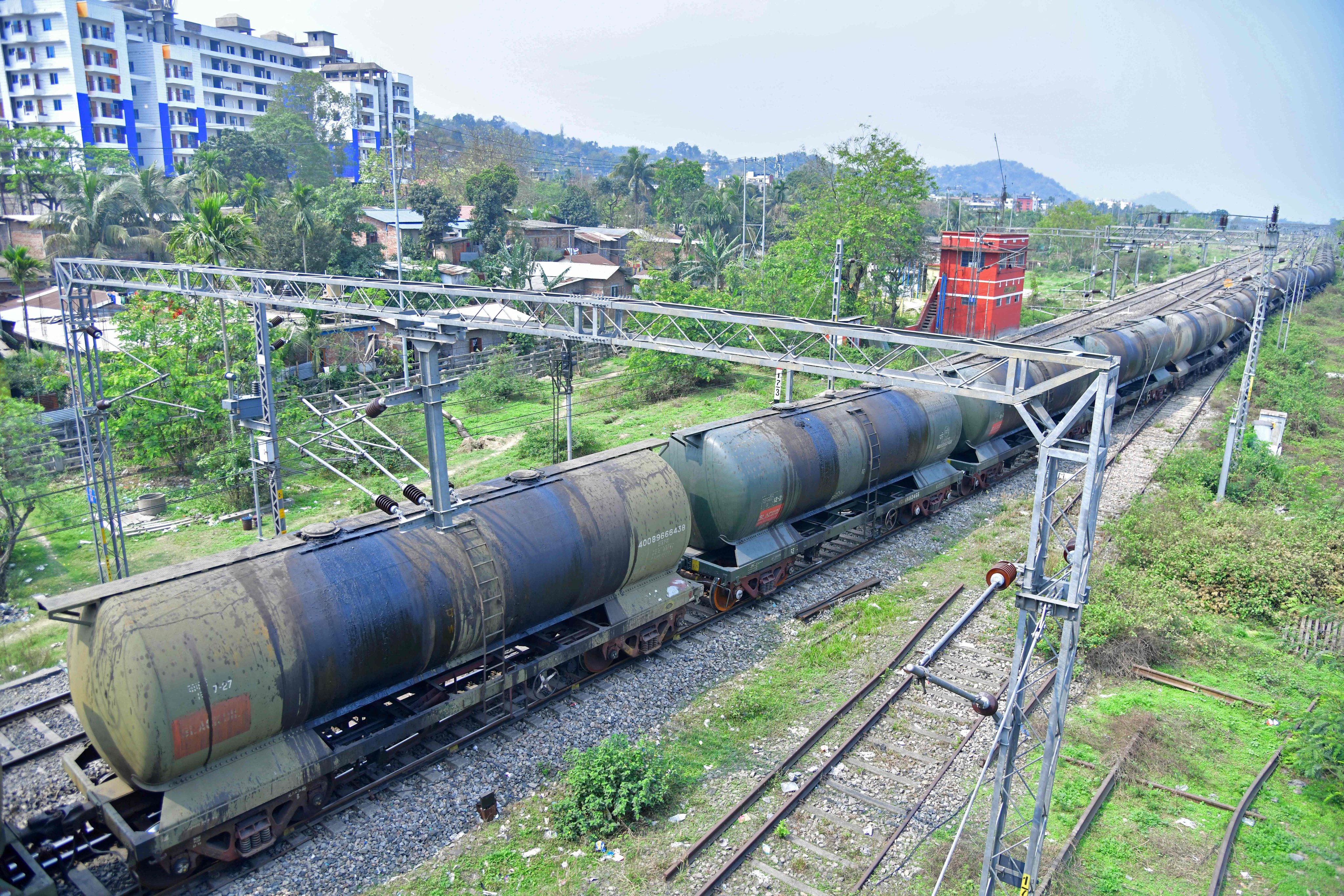 An oil tankers train passes near a refinery in Guwahati, India, in March 2023. Photo: AFP