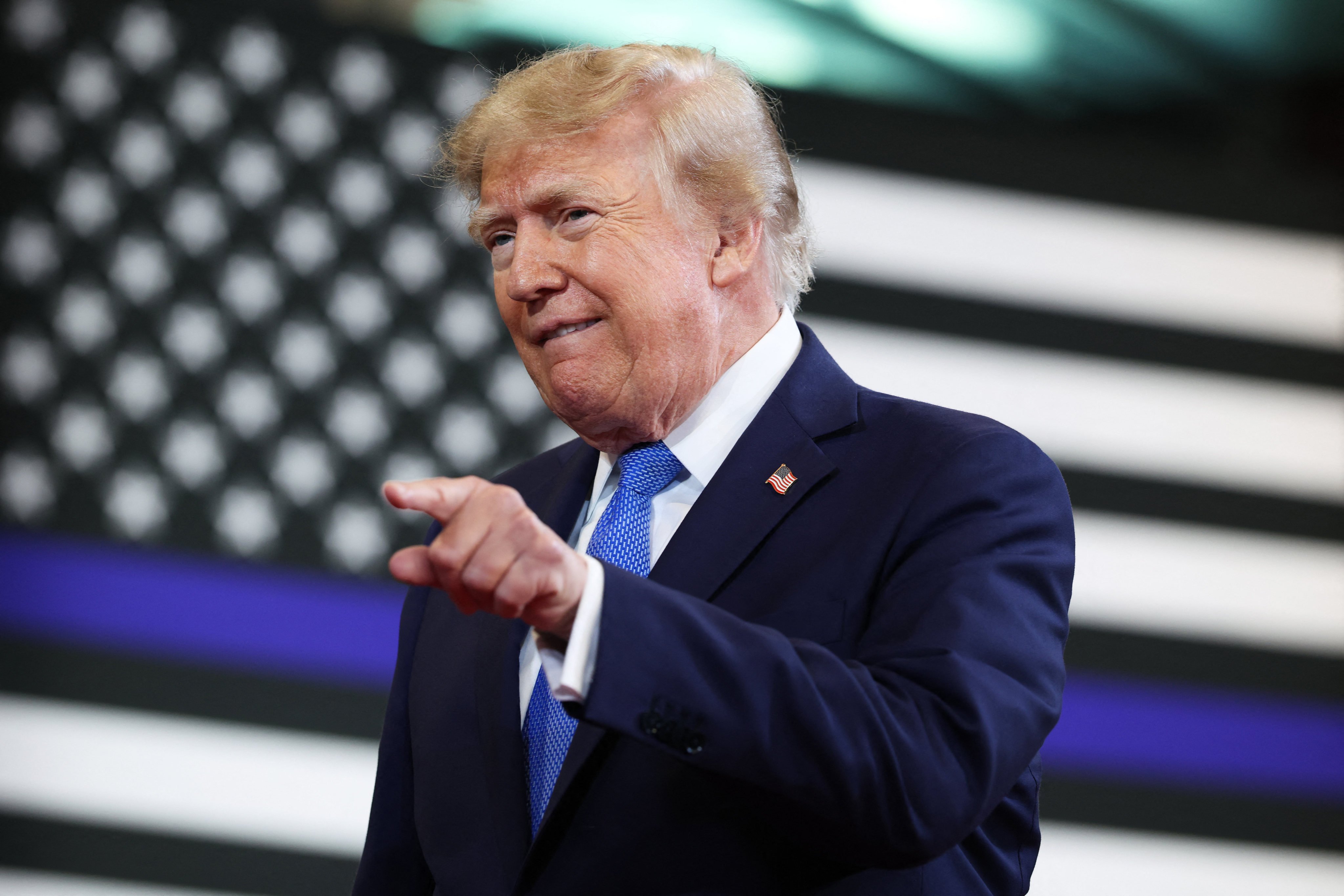 GARDEN CITY, NEW YORK - AUGUST 14: U.S. President Donald Trump arrives to deliver remarks at the David S. Mack Center for Training and Intelligence on August 14, 2026 in Garden City, New York. President Trump visited the police academy to highlight the FBI’s 2025 Crime Statistics Report and rally support for local Republican candidates ahead of the upcoming midterm elections.   Samuel Corum/Getty Images/AFP (Photo by Samuel Corum / GETTY IMAGES NORTH AMERICA / Getty Images via AFP)