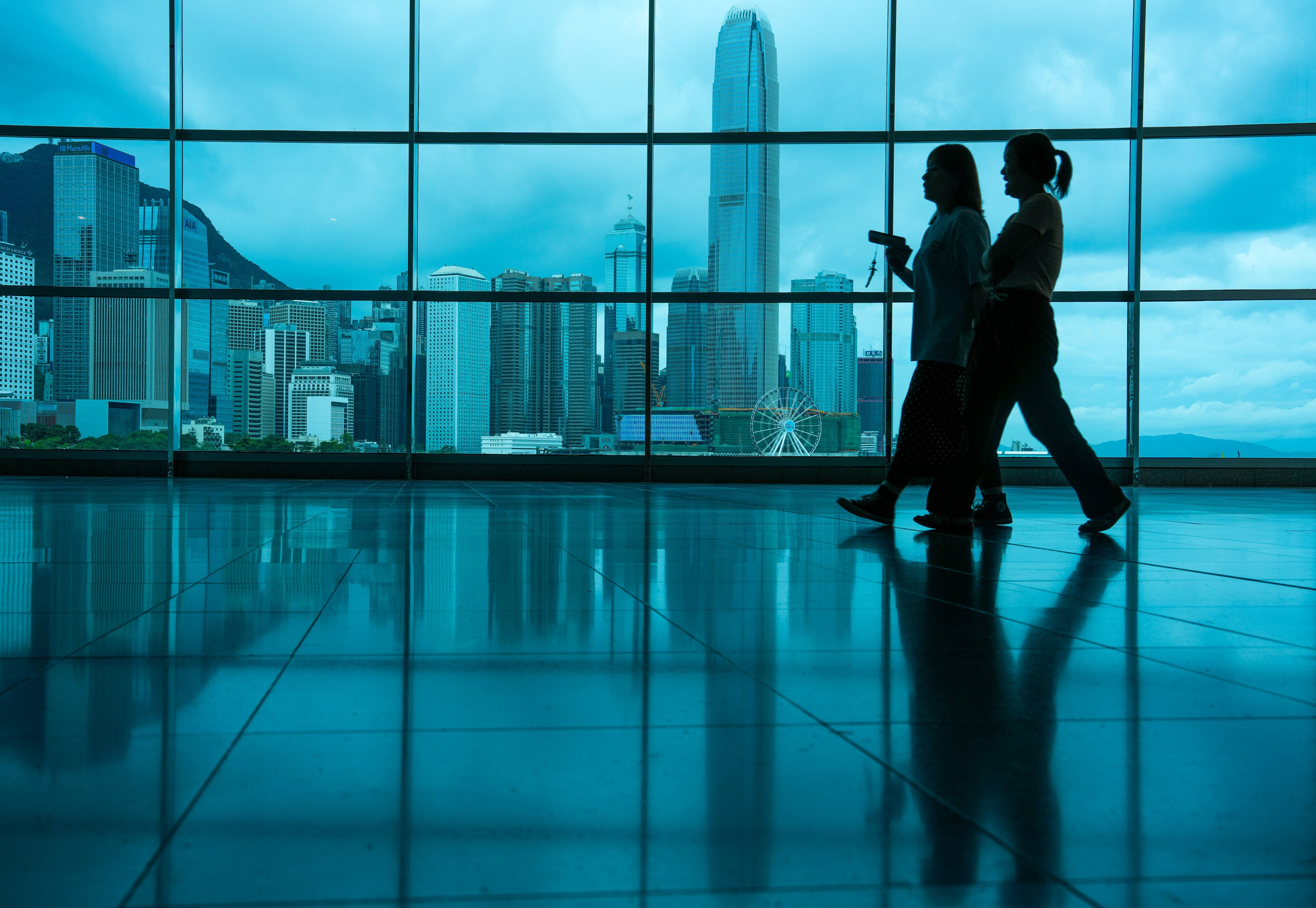 Visitors walk inside Hong Kong Convention and Exhibition Centre in Wan Chai. Photo: Sam Tsang