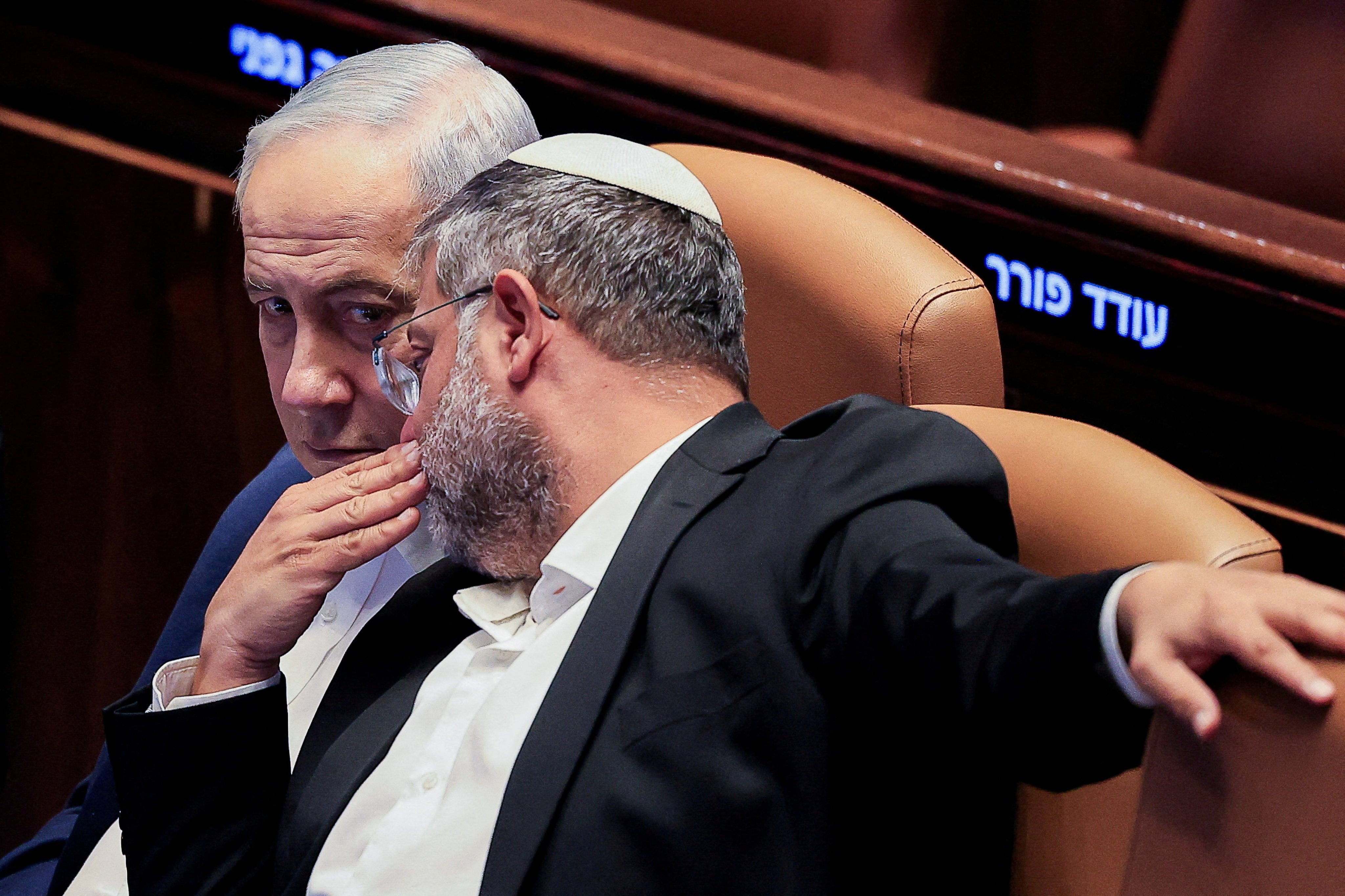Israel’s Minister of National Security Itamar Ben-Gvir speaks to Prime Minister Benjamin Netanyahu during a parliamentary session on July 16. Photo: Reuters
