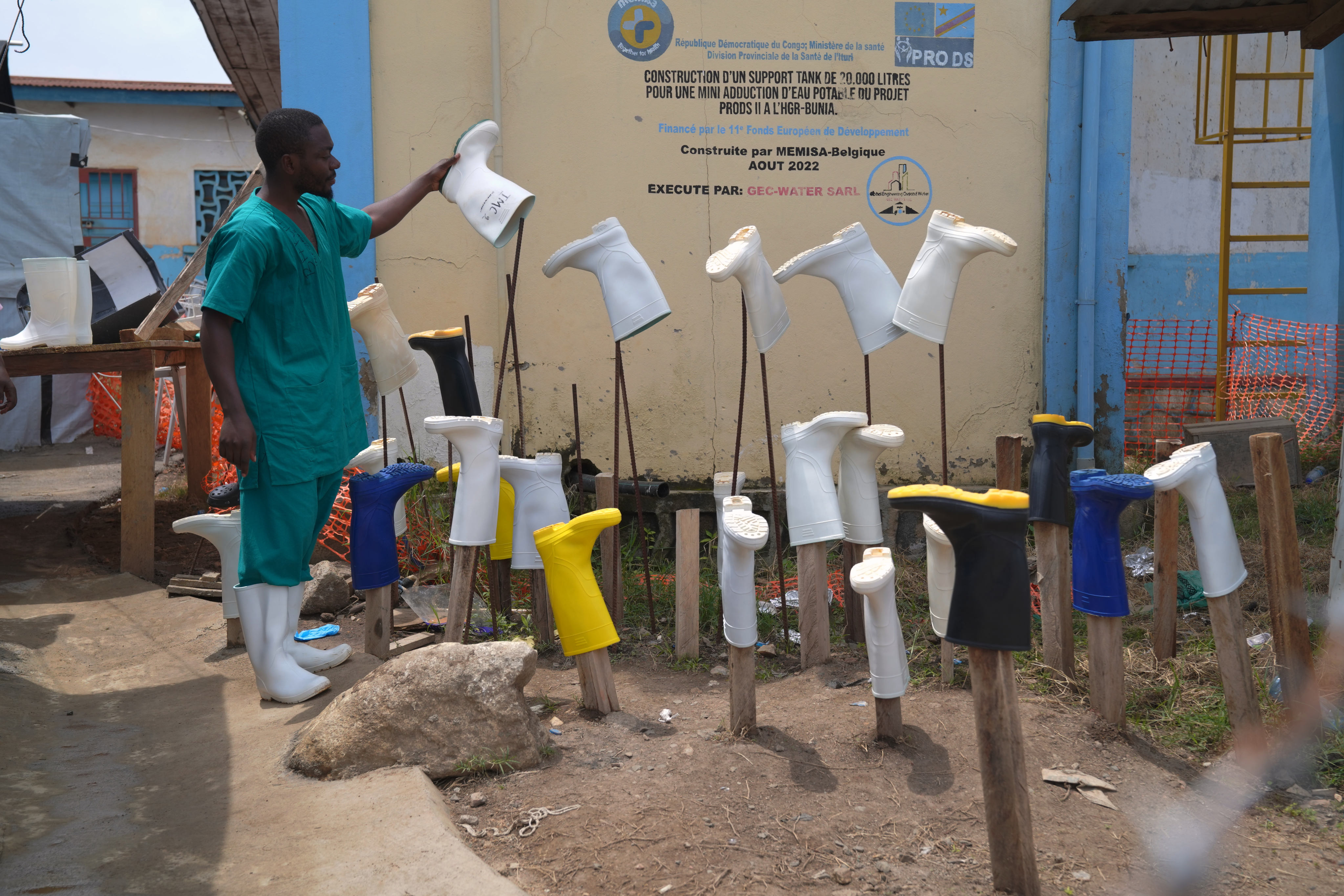 A health worker dries boots that were washed to prevent the spread of the Ebola virus at the treatment centre in Bunia General Hospital in Ituri, eastern Congo, on August 11. Photo: AP