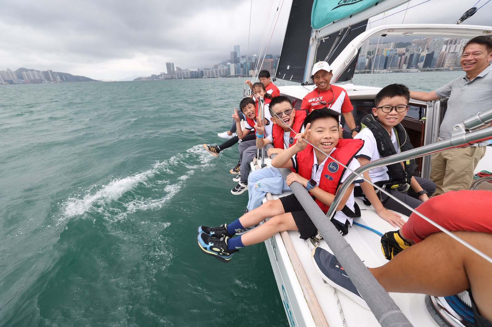 Thanks to a charity initiative, about 60 young people and their family members have had the experience of sailing along Victoria Harbour. Photos: Nora Tam