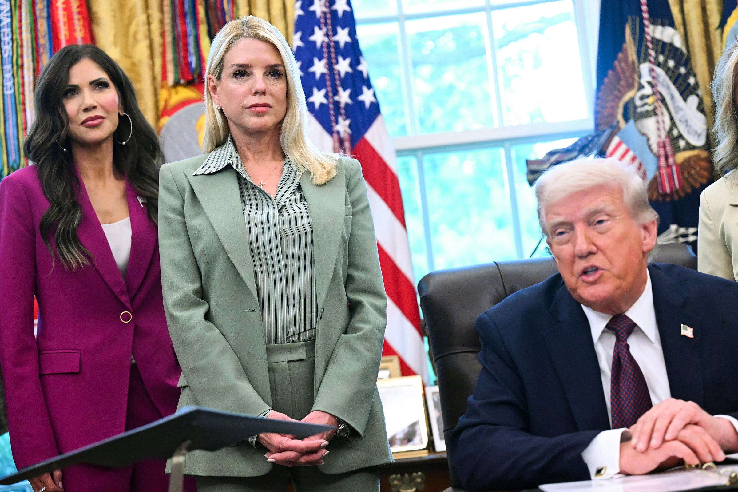 US Secretary of Homeland Security Kristi Noem (left) and Attorney General Pam Bondi with President Donald Trump at the White House last year. Photo: AFP/Getty Images/TNS
