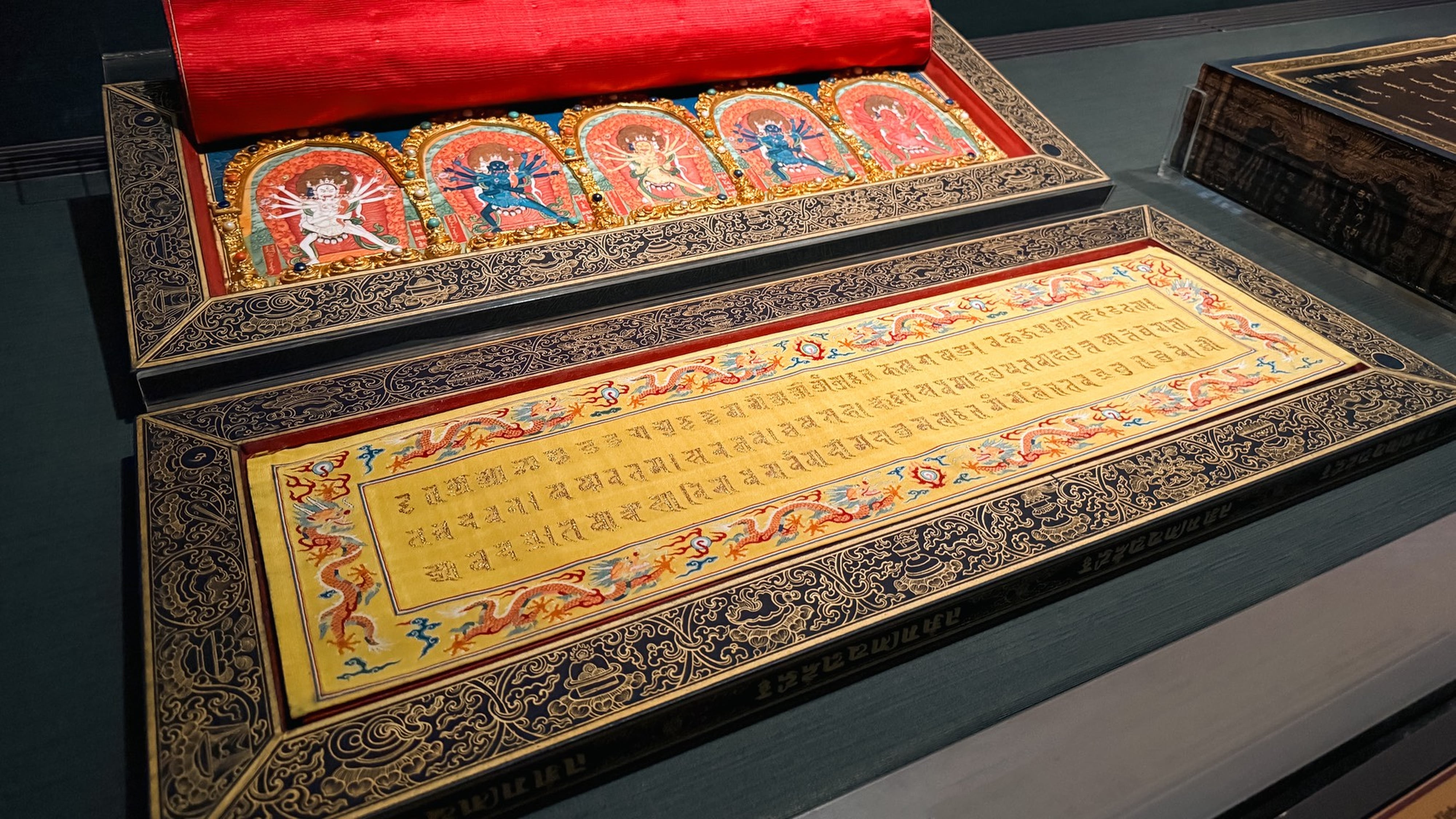 A gold-inked manuscript from the Tibetan Dragon Canon, which is on show as part of the “Tibetan Dragon Canon: A Symphony of Imperial Power, Belief and Art in a Golden Age” exhibition at Taiwan’s National Palace Museum until November 8, 2026. The 357-year-old text has recently gone viral for apparently granting those who view it seven lifetimes of good karma. Photo: NPM