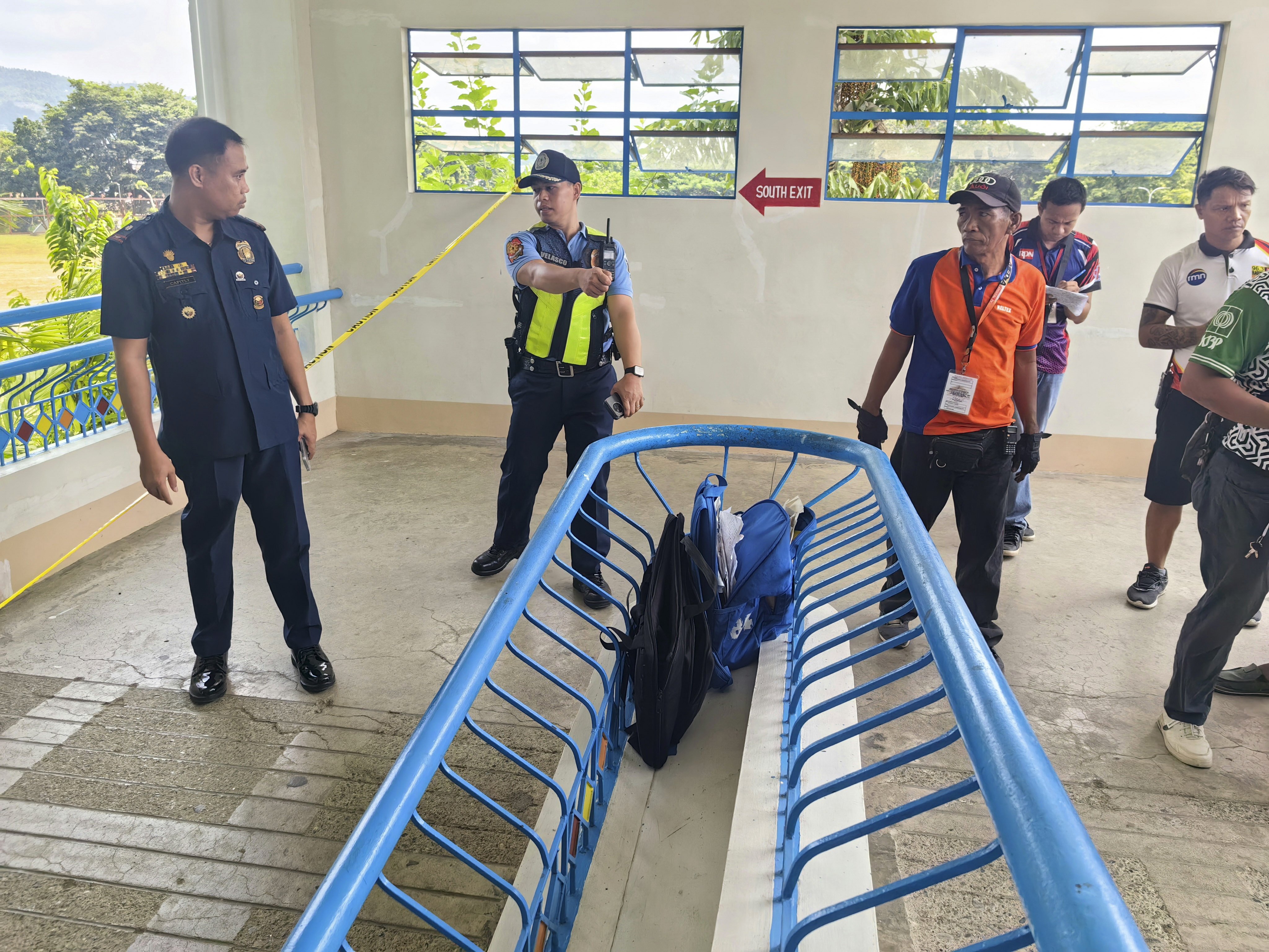 Philippine police (left) patrol the area around the Ateneo de Zamboanga University Junior High School building in Zamboanga City on Tuesday. Photo: EPA