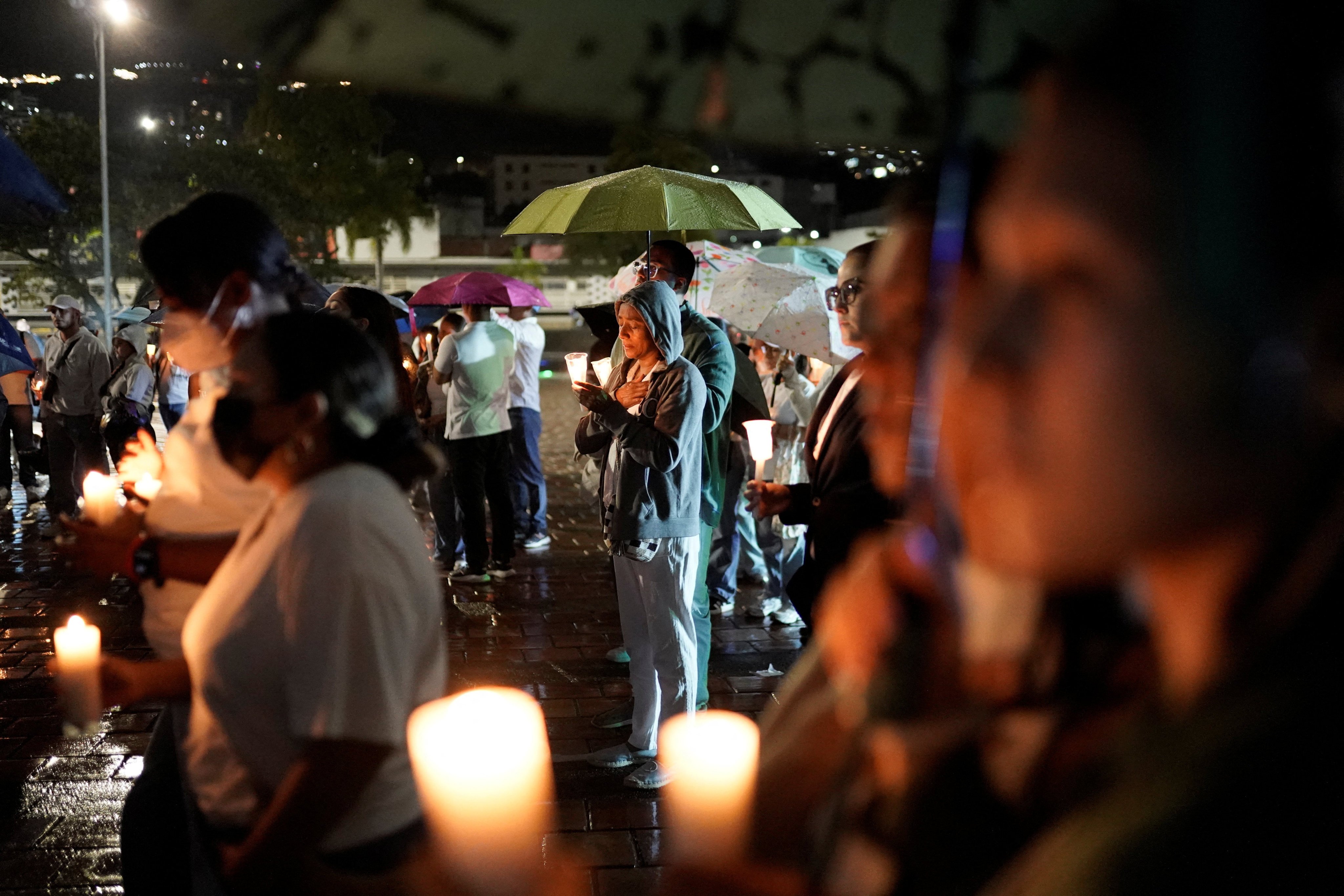 People attend a candlelight vigil in memory of the earthquake victims in Cali, Colombia, on Monday. Photo: Reuters