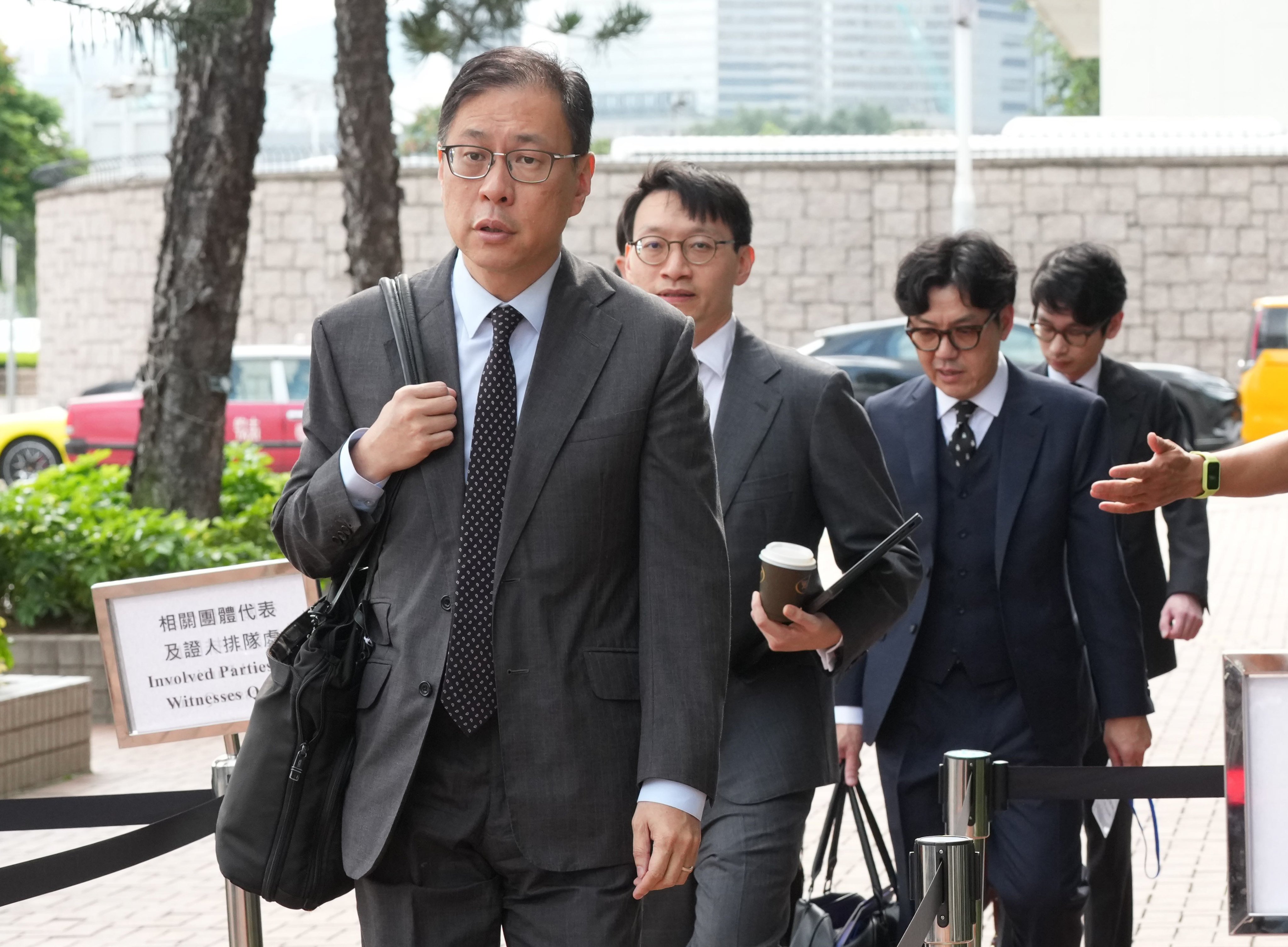 The independent committee investigating the Wang Fuk Court fire, led by Victor Dawes SC (front), held a total of 30 sessions across six rounds of evidential hearings from March 19 to July 17. Photo: Jelly Tse