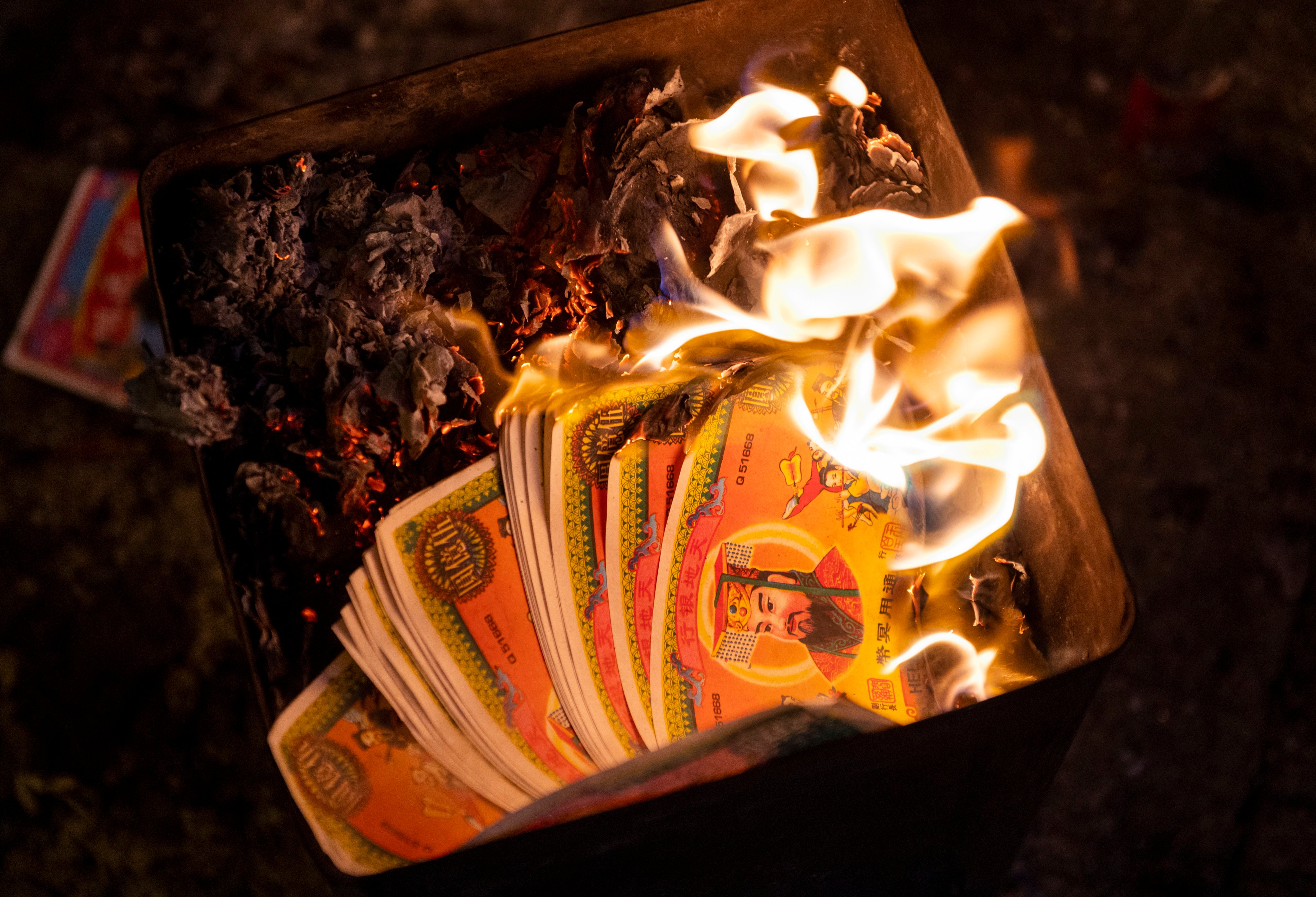 Paper money being burned during Hungry Ghost Festival. Photo: Getty Images