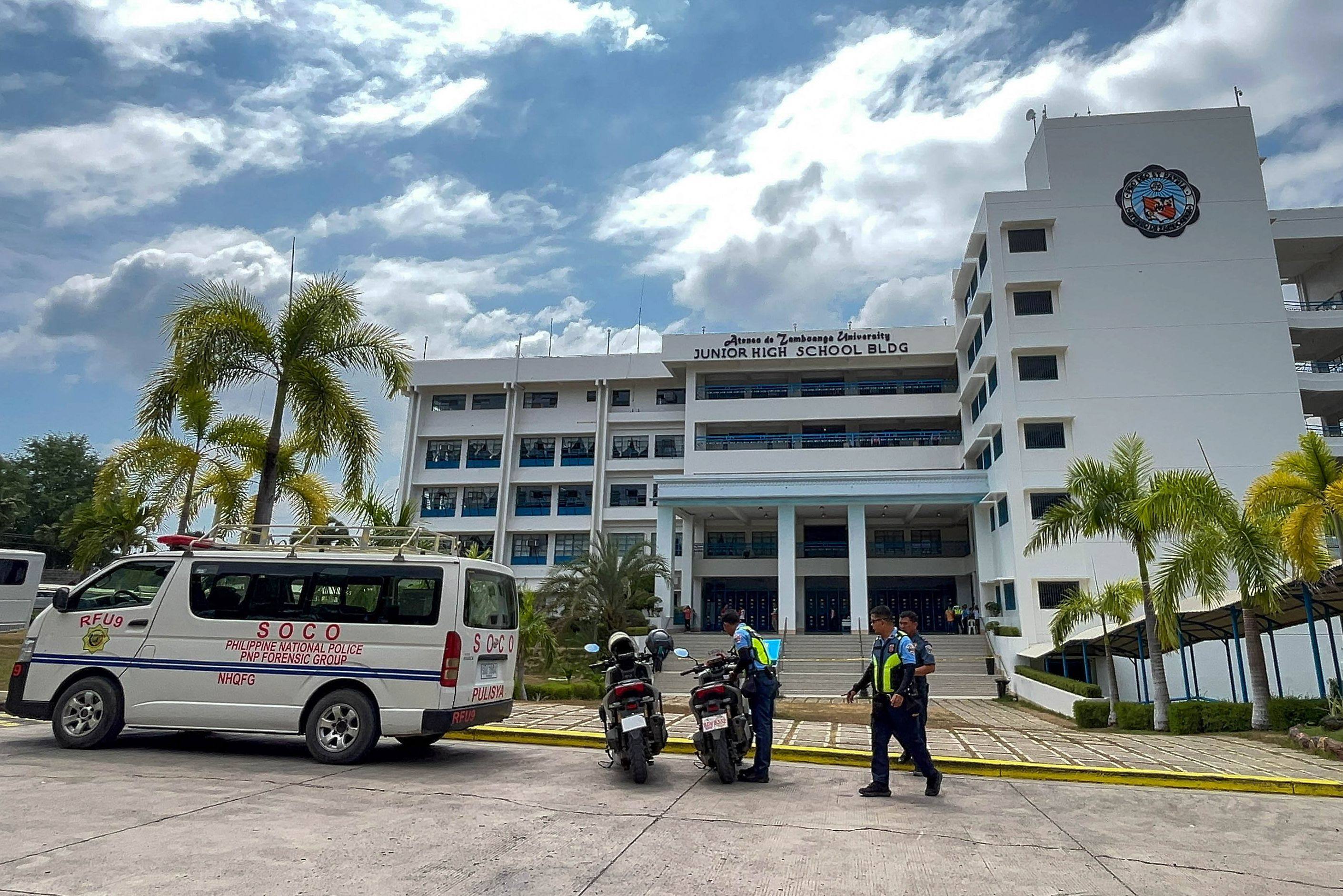 Police gather at Ateneo de Zamboanga University following a shooting at the school in Zamboanga on Tuesday. Photo: AFP