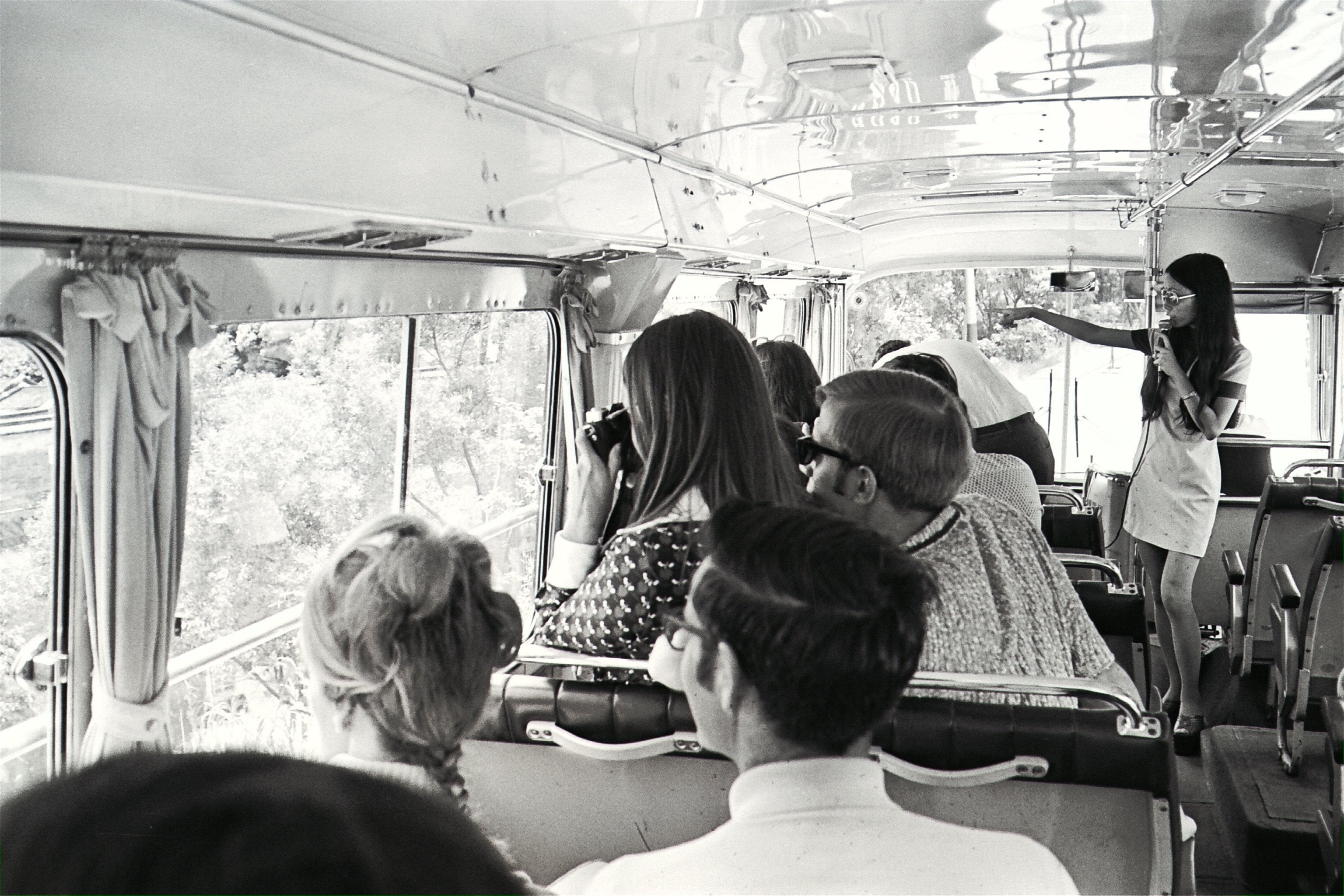 Louisa Lam (standing), one of the city’s 700 registered tour guides, introduces Hong Kong’s many attractions on a sightseeing bus, in 1973. Photo: SCMP Archives