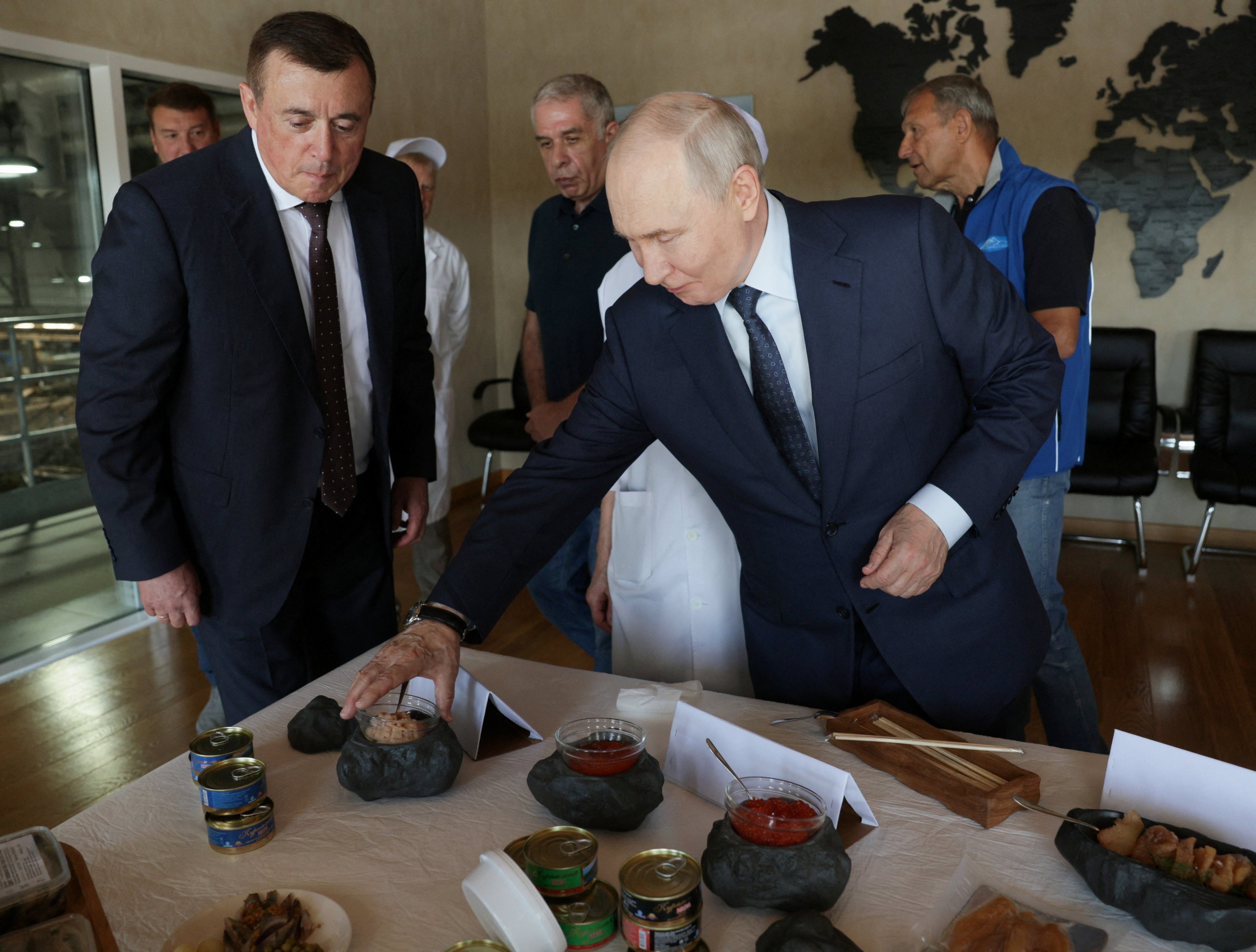 Russian President Vladimir Putin during his visit to the Yasny fish processing complex on the Kuril Island of Iturup on Thursday. Photo: Sputnik / Gavriil Grigorov / Pool via Reuters
