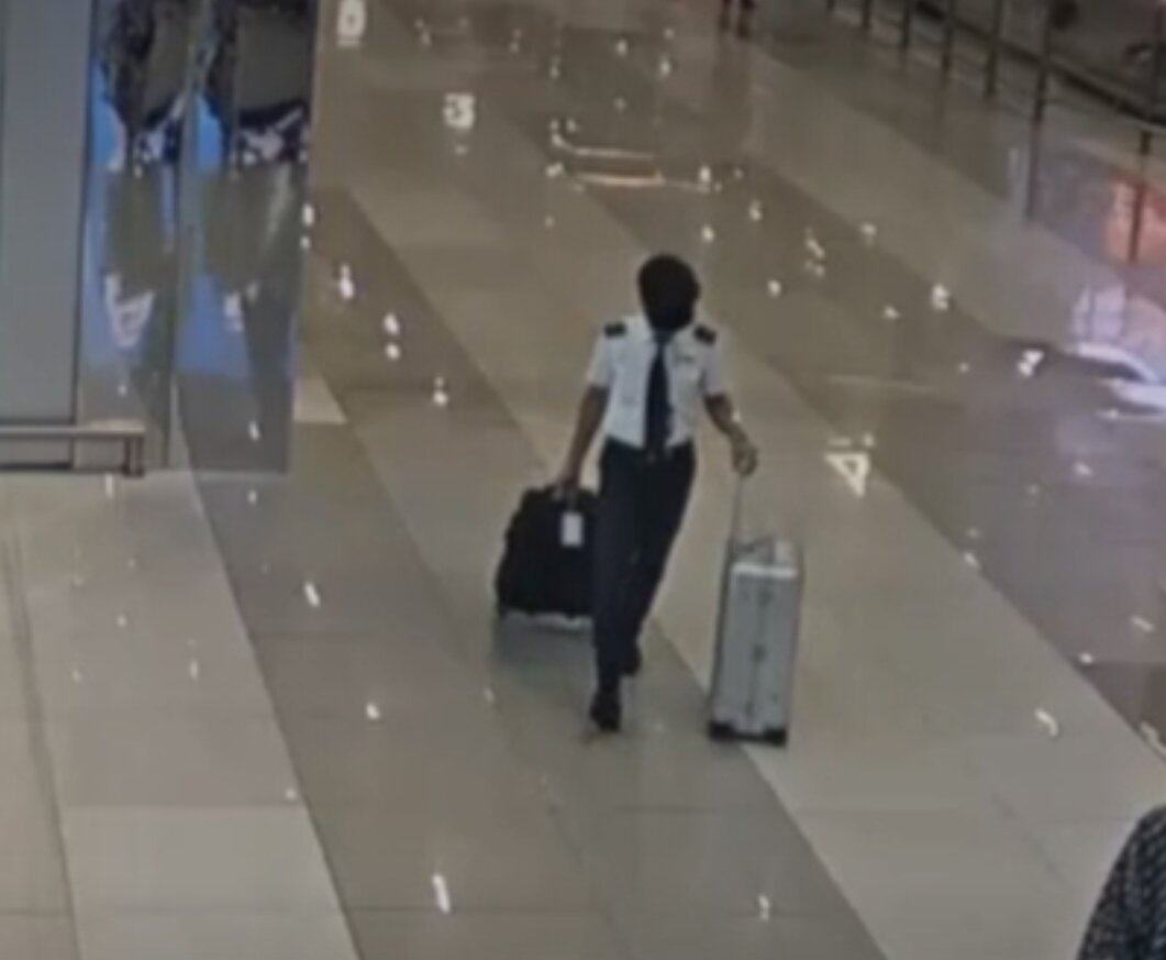 A Malaysia Airlines pilot is seen on CCTV wheeling two bags, later found to contain drugs, at Jakarta's Soekarno-Hatta International Airport on July 28. Photo: Handout